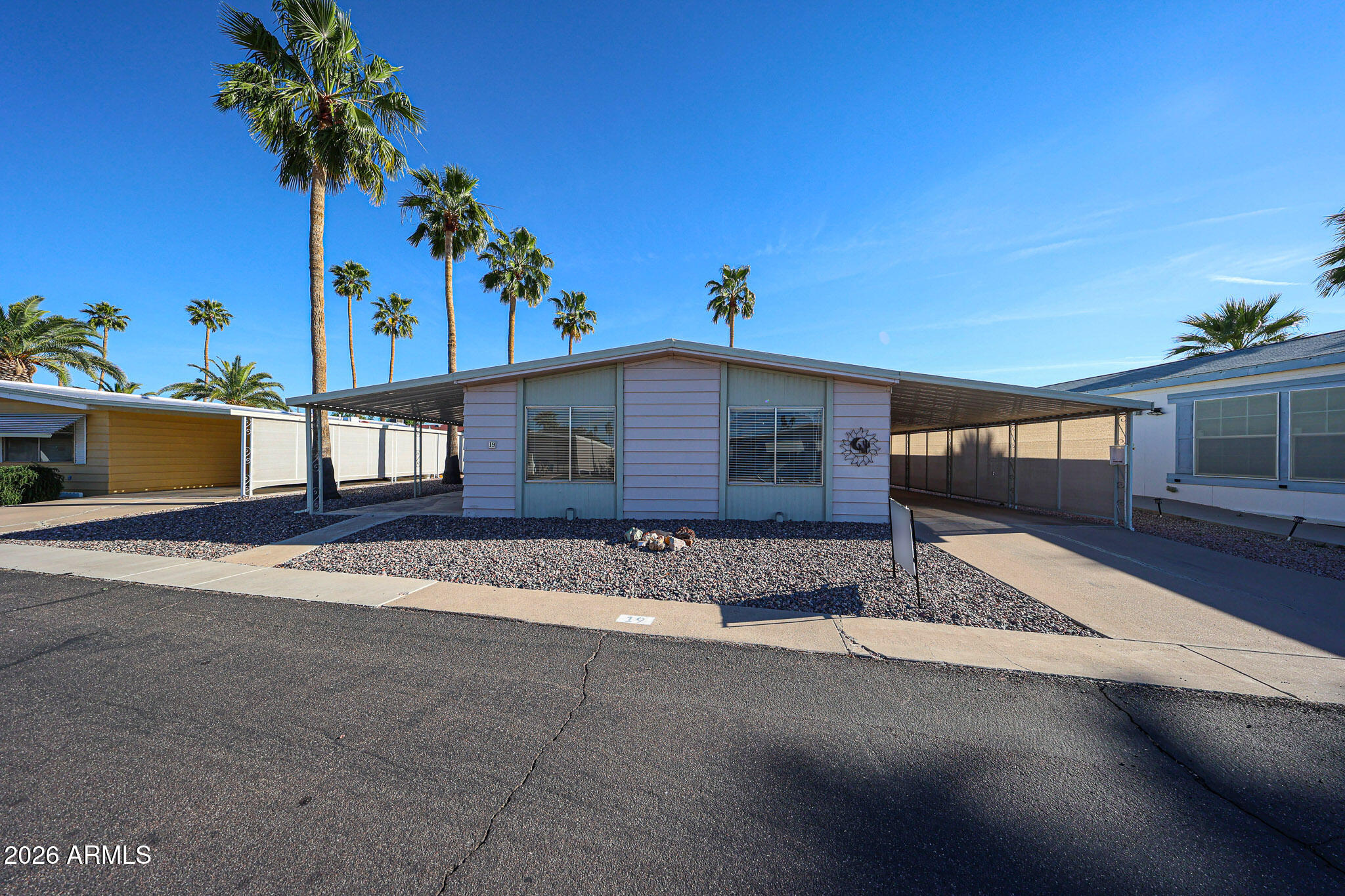 Price cut in half!  Nice home in good shape, furnished so all you need is your suitcase to move in. Roof is about 5 years old, AC is 2 years old as is water heater.  There is a nice az space accessible through patio doors from outside.  Everything is in nice shape, and you will especially like the walk in shower. and spacious living area.
Roof is about 5 years old, AC about 2, Hot water tank about 2.  55+ subdivision, new owner must qualify with the park.