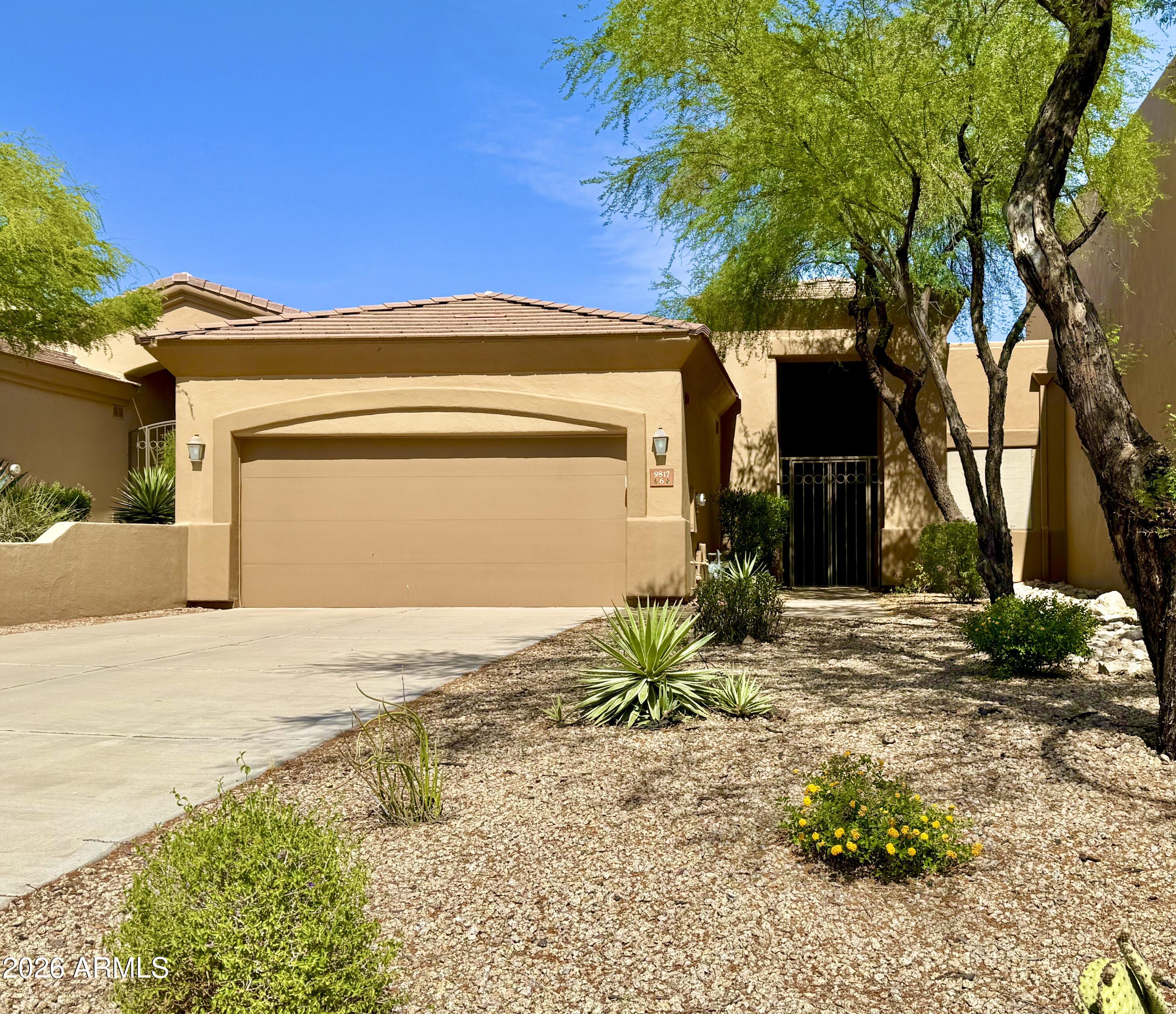 Welcome to resort style living in your beautiful townhome located in the private guard gated La Loma Eagle Mountain community. Inside you will discover a spacious open floor plan, 3 bedrooms, 2 baths, large great room with granite surround gas fireplace, bullt-in entertainment center, high ceilings, large kitchen with granite counters, breakfast room and pantry, Outside you will find a large private patio backyard with amazing desert views. Other features include shade screens, 2 car garage with storage & epoxy floor, no interior steps, security screen door & courtyard gate, privacy & views. Ideal for year-round living or lock & leave. Plus, easy access to the Golf Course, Community Pool/Spa, Shopping, Dining, Hiking and all that Fountain Hills has to offer!