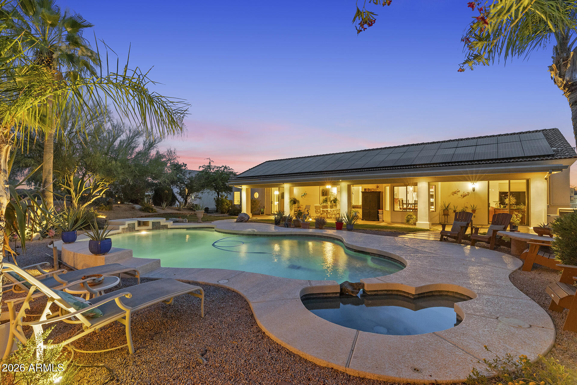 Freedom, space, and luxury in the desert - this exceptional estate has it all! Situated on over an acre with NO HOA, this updated 4-bed, 3.5-bath home offers 2,875 sqft of beautifully upgraded living space with stunning desert and mountain views! Enjoy major upgrades including owned solar, updated HVAC and roof, plus freshly updated flooring and pool (2026). The spacious primary suite features a walk-in closet, sitting area, and full bath. Car enthusiasts and hobbyists will love the 1,900 sqft detached garage with RV access and parking, along with an additional 3-car attached garage. Step outside to a resort-style backyard with a diving pool and in-ground spa - perfect for entertaining. With endless space and premium upgrades, this property delivers desert living at its finest!