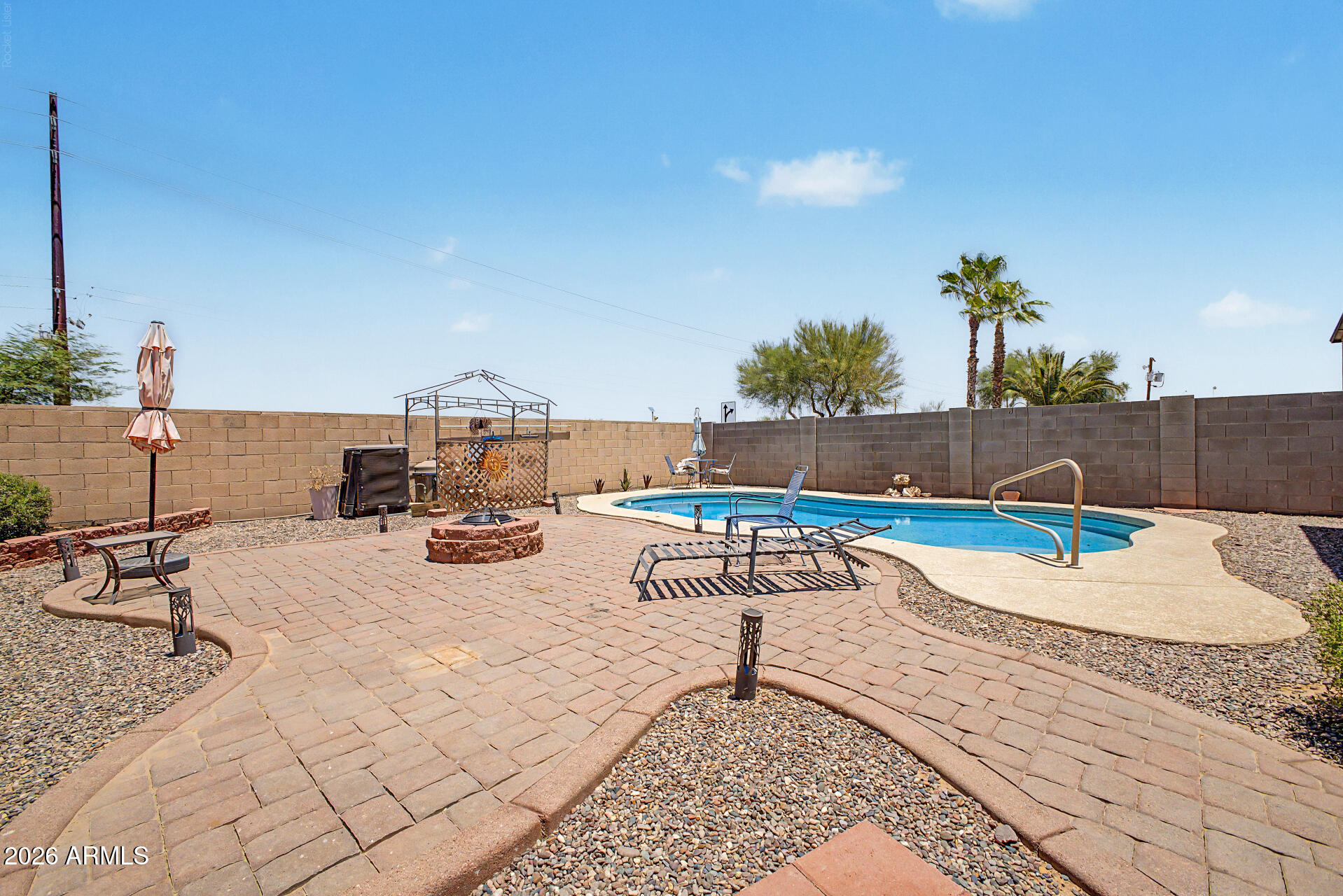INCREDIBLY priced 3-bedroom, 1.75-bathroom home in the desirable community of Johnson Ranch with tons of amenities! Open floor plan with eat in kitchen overlooking the living room. Home complete with backyard oasis featuring a heated pool, pavers and a fire pit, all completed in 2021! Garage includes permanent floor-to-ceiling cabinets plus additional steel shelving for plenty of storage. Some patio furniture, umbrellas and pool supplies may convey to help you start enjoying the space right away. Newer HVAC just in time for summer. Growing location just minutes away from dining, shopping and the new San Tan Valley Target.
