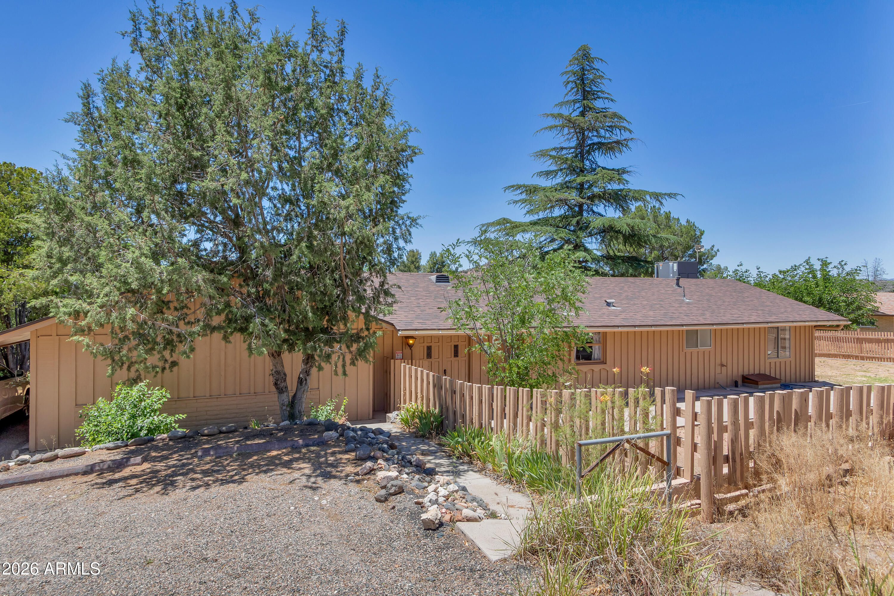 Move-in ready with major updates already completed! This 3-bedroom, 1-bath home sits on a .43-acre lot backing to the former Beaver Creek golf course, offering added privacy and open space. Recent improvements include a new roof (2023), HVAC system (2023), luxury vinyl plank flooring in the living room, family room, and primary bedroom (2026), plus fresh interior paint throughout. The rear access easement provides convenient backyard access for RVs, trailers, boats, and outdoor equipment. There is a covered patio, storage shed, one-car carport, and two dedicated parking spaces. Located in Lake Montezuma, this home offers a relaxed Verde Valley lifestyle with easy access to I-17, Sedona, Cottonwood, and Camp Verde.