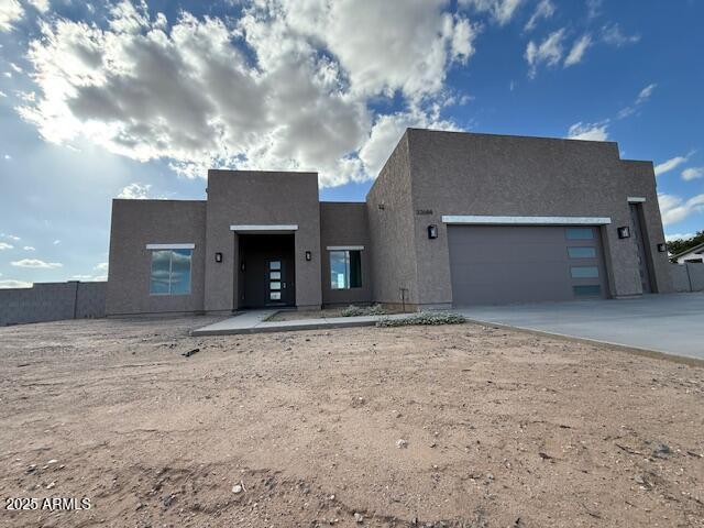 Stunning brand-new 2,200 SF home on 1.125 acres with no HOA! This 3 bed plus DEN, 2.5 bath beauty showcases premium 2x6 construction, Shear wall thru-out, Spray foam  walls and ceiling including garages, Flat roof, and an oversized RV + 2-car garage. Inside, enjoy airy 8' shaker doors, ceramic tile in high-traffic areas, plush carpet in bedrooms, and stylish ceiling fans throughout. The chef's kitchen shines with quartz counters, 42'' shaker cabinets, GE stainless appliances (including refrigerator), propane gas cooktop, and 30'' hood. Relax in the owner's suite with soaking tub, walk-in shower, and spacious closet. A large covered patio, tankless water heater, shared well, and septic complete this exceptional property! Buyer to verify school information.