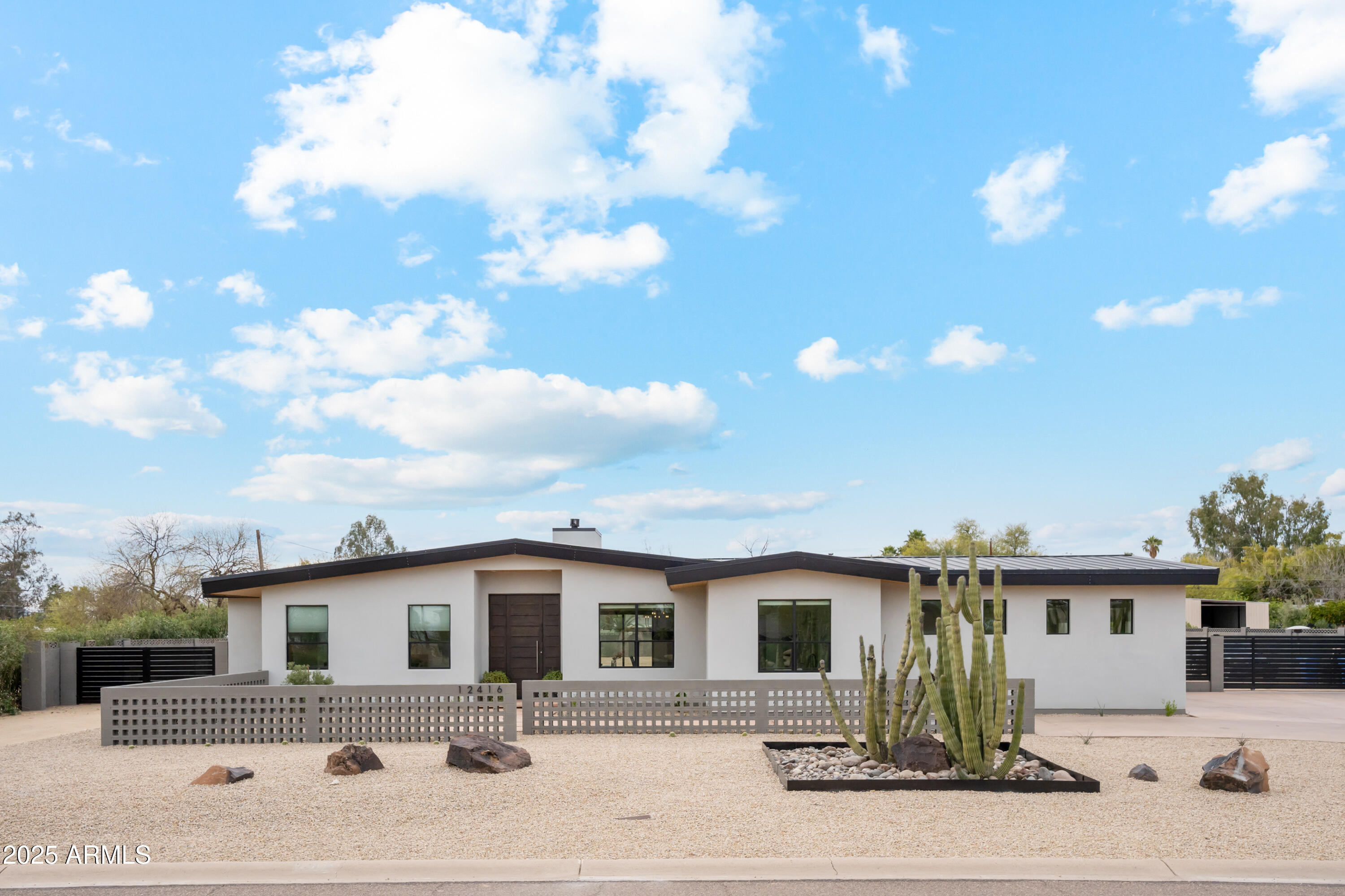 Move-in ready in Coveted Cactus Corridor! Unparalleled Modern Split Floor Plan Built in 2020 of almost 4,000sf & just re-finished into a brand-new home! Sitting on over 36,000sf lot in the highly desirable 85254 zip code in Scottsdale! This home is modern, light, bright, and highly functional with 2 Primary Bedrooms, and 3 kids bedrooms or office & 3.5 baths. The floor plan offers lifestyle & comfort and is ready to make it your own. Walk through and feel a home that provokes a sense of serenity, simplicity, and unequaled quality and beauty. A magnificent layout greets you in the living, dining, and kitchen as the main areas. Then span to the two Primary BR to the left. To the right, you'll find the office, kids' bedrooms, with also a spa-like bath and a generous family/playroom or stud for maximum functionality. Your clients will love this floor plan with finishes like Italian porcelain floors, Watermark by Rejuvenation faucets, all floating vanities with spa baths dressed in exquisite Italian tiles & finishes. The backyard is a blank canvas to design your own oasis to best fit your lifestyle. New front landscape and automatic watering system. The over 1,000sf RV garage is connected to the sewer, water, and electrical subpanel, and can easily be converted into a guest house, or gym!