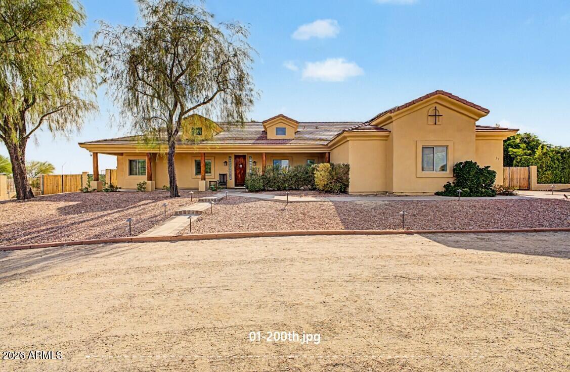 Every so often, a true unicorn hits the market. A home that offers the privacy of an estate, the warmth of modern rustic design, and the lifestyle most buyers spend years searching for.  This custom estate feels like your own private desert retreat.  As you arrive, rows of mature trees, lush greenery, and colorful landscaping create a setting that's both peaceful and unexpected, while mountain views provide the perfect backdrop.
Step inside and you'll immediately notice the brand-new faux wood porcelain tile flooring, all new carpet and pad in the bedrooms, and fresh interior paint that give the home a warm yet contemporary feel.   A custom pool invites you to unwind, while the separate casita/pool house opens the door to endless possibilities--guest area, or private retreat.   See more The upgrades continue with a fully paid-off solar system for long-term energy savings, a hard-wired security system for added peace of mind, and a brand-new irrigation system that keeps the beautiful grounds thriving with ease.