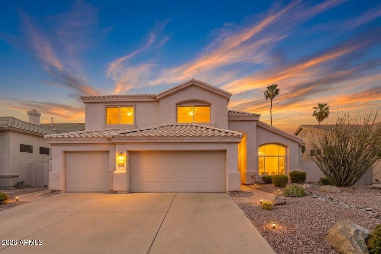 Located in the Arrowhead Camelot Views lake community, this Glendale home offers a great combination of major updates, outdoor living, and a location close to parks, a golf course in your backyard, and everyday conveniences. With owned solar panels, a sparkling pool, and several big ticket improvements already completed, this home makes a perfect move in ready opportunity! 
Inside, the kitchen features granite countertops, a center island, and plenty of cabinetry for storage and workspace. The layout flows naturally into the main living areas, where a fireplace adds warmth and character to the space. Out back, a pool with water feature, built in BBQ, and gorgeous golf course views create an outdoor space that is easy to enjoy throughout the year, whether relaxing at home or spending time with friends and family. And the HVAC system, roof, and water heater are all only about three years old. A 3 car garage also provides extra room for vehicles, storage, or hobbies. Residents of Arrowhead Camelot Views enjoy a lake neighborhood setting with nearby walking paths, children's playgrounds, golf courses, and close access to Thunderbird Conservation Park for hiking, biking, and outdoor recreation. The location also offers convenient freeway access and close proximity to Midwestern University, along with shopping and dining nearby.