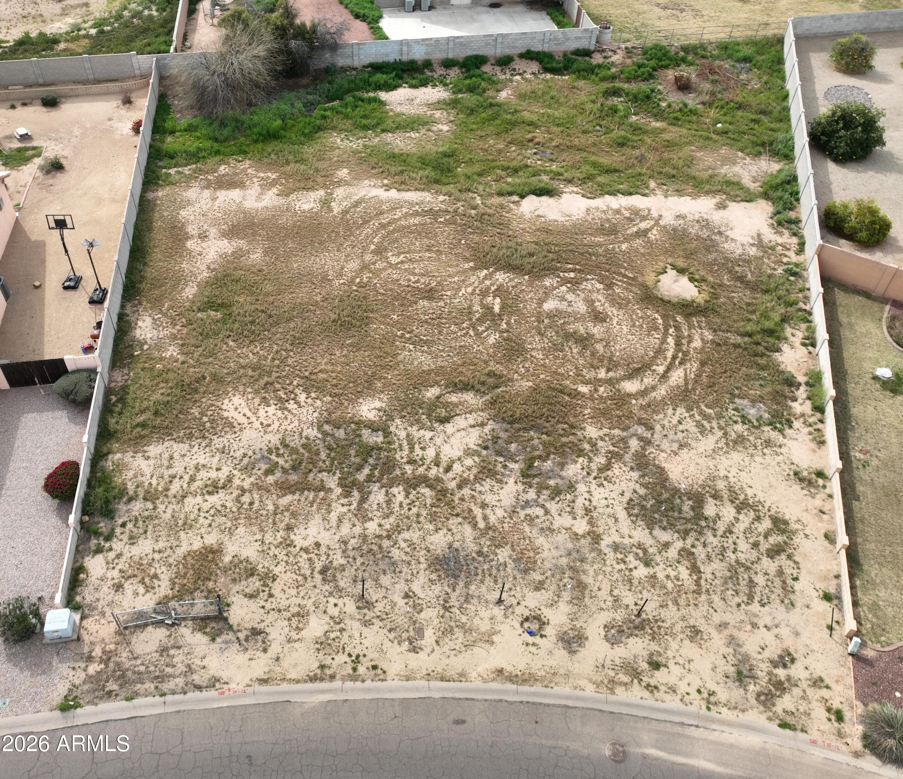 Build your custom dream home in the heart of the rapidly growing West Valley within the highly sought-after Emerald Point community. This is one of the few remaining lots available — nearly ½ acre with NO HOA. Conveniently located near I-10 and Loop 101, with easy access to NFL & NHL stadiums, Westgate Entertainment District, and Tanger Outlets. The parcel is in good shape, features block fencing along most of the property, and is READY TO BUILD with utilities already on site. Buyer to verify all pertinent information.