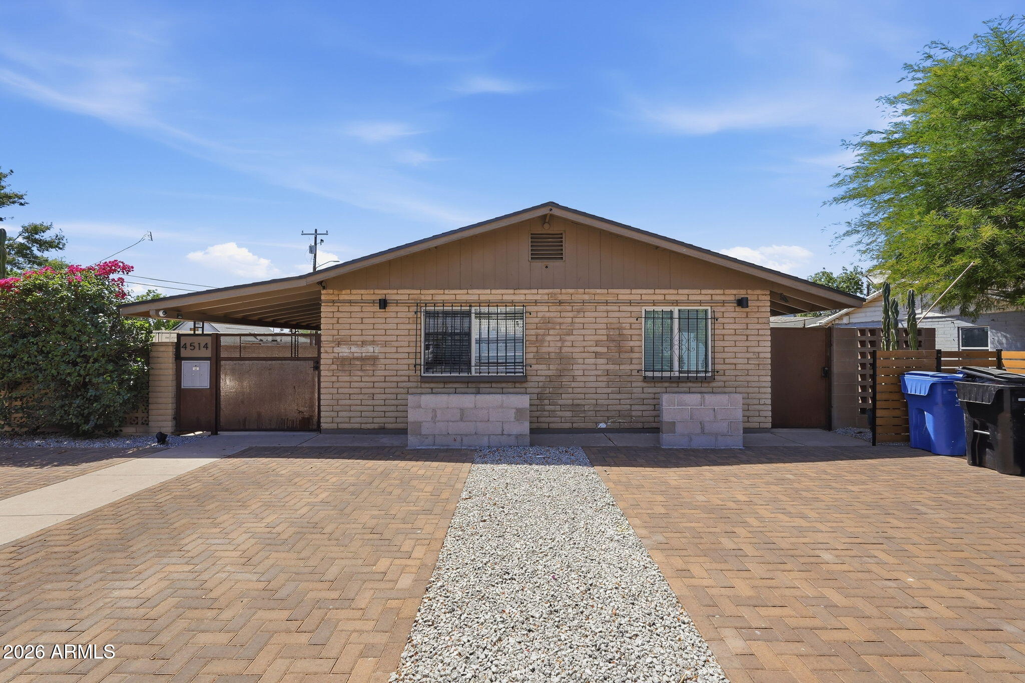 Exceptional investment opportunity in the heart of Central Phoenix. Ideally situated near the Biltmore Area and Downtown Phoenix, this gated triplex offers strong in-place income with zero vacancy and modernized interiors throughout. The property features two 1 bed / 1 bath units and one 2 bed / 1 bath unit, all thoughtfully updated while maintaining a touch of mid-century character. Tenants enjoy a private, lushly landscaped courtyard, along with semi private patios for each unit, creating a unique community-oriented living environment. Additional highlights include covered parking for three vehicles plus 3 uncovered spaces, multiple storage areas, and a shared laundry room with washer and dryer included. Each unit is separately metered for gas and electric and equipped with its own separately metered for gas and electric and equipped with its own HVAC system and water heater, minimizing owner expenses and simplifying management. Ideal for investors seeking stable cash flow, with future flexibility. Potential owner-occupant opportunity available as early as July. These opportunities do not come up often!