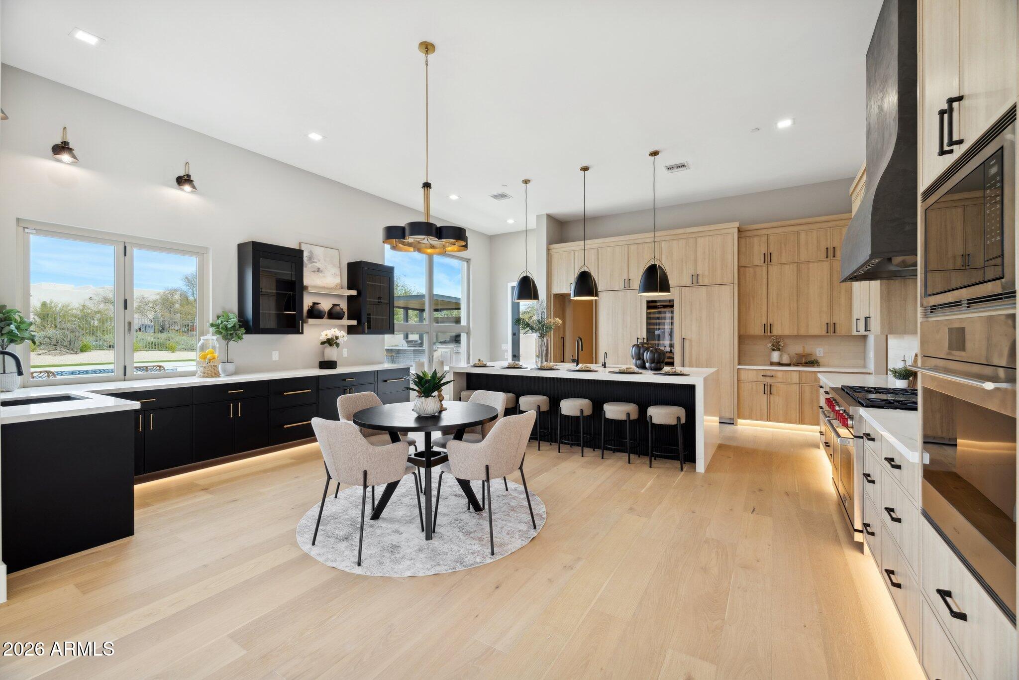 Stunning luxury remodel in coveted North Scottsdale gated community — turnkey and move-in ready. This thoughtfully reimagined single-level home features high-end finishes throughout, an open chef's kitchen with designer cabinetry and premium appliances, dramatic living spaces with abundant natural light, and elegant architectural details that blend modern sophistication with warm, earthy tones. All bedrooms are ensuite, plus an attached guest casita for private accommodations. The spa-like primary suite is a serene retreat with a luxe bath, oversized shower, and spa amenities designed for relaxation. Designer landscaping and interior touches create a refined, zen-inspired atmosphere. Outdoor living is exceptional: a true resort backyard with two covered ramadas for maximum entertaining, expansive patios, mature desert plantings, and a private pool/spa  ideal for large gatherings or intimate evenings. Located in a highly desirable neighborhood close to premier dining, shopping, hiking, and golf. Experience elevated Scottsdale living with impeccable finishes, thoughtful design, and unparalleled indoor-outdoor lifestyle in a gated community.