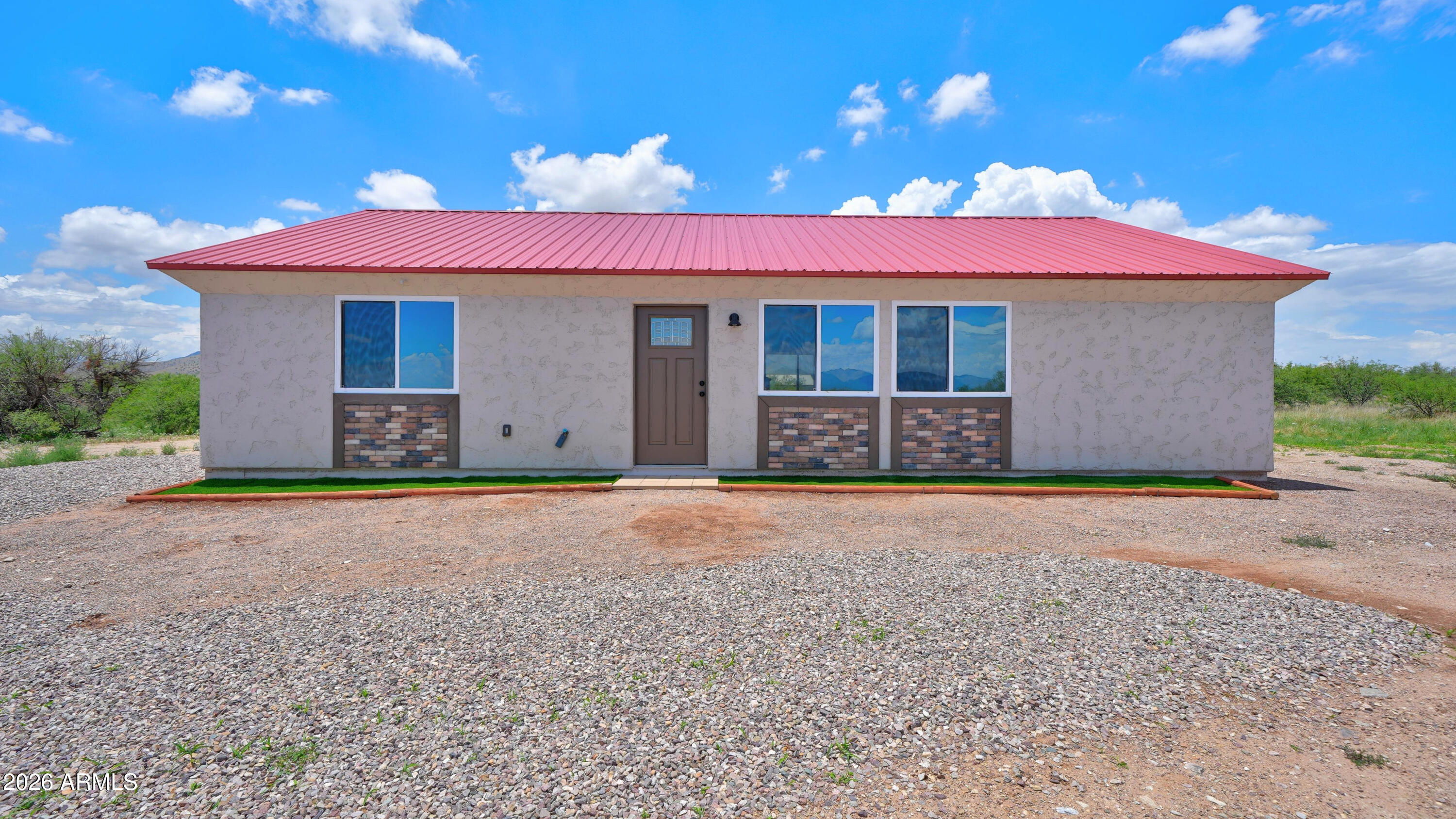 Discover peaceful country living with this brand-new, energy-efficient home on 8 private acres! Built with low-maintenance stucco, a Lifetime metal roof, and spray foam insulation, this quality site-built home is designed for comfort and savings. Enjoy breathtaking mountain views through large picture windows, Tall vaulted ceilings, and beautiful real wood trims. The spacious kitchen features granite countertops, real wood cabinetry, Good quality appliances, and flows into the cozy Living area complete with an electric fireplace. The custom-tiled shower adds a touch of Luxury, while the private setting among other custom homes offers the perfect balance of tranquility and convenience. A rare opportunity at this Low price--Don't miss this brand new quality built home!