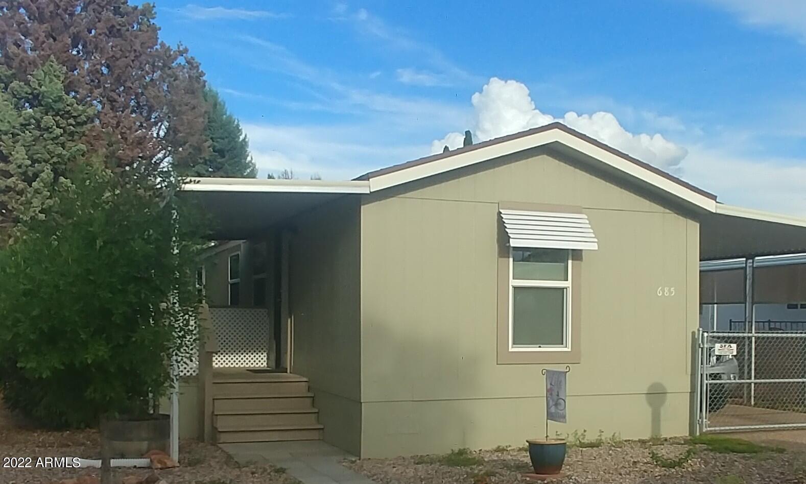 Cute and clean!!! Open and roomy living area. Some of the newer items are only approximately 2 years old to include, roof, cabinets, gas pack, windows and flooring. Covered and gated carport parking, patio and good sized fenced in  yard with shed. Gated community with 2 pools (one indoor) spa, 2 community centers.