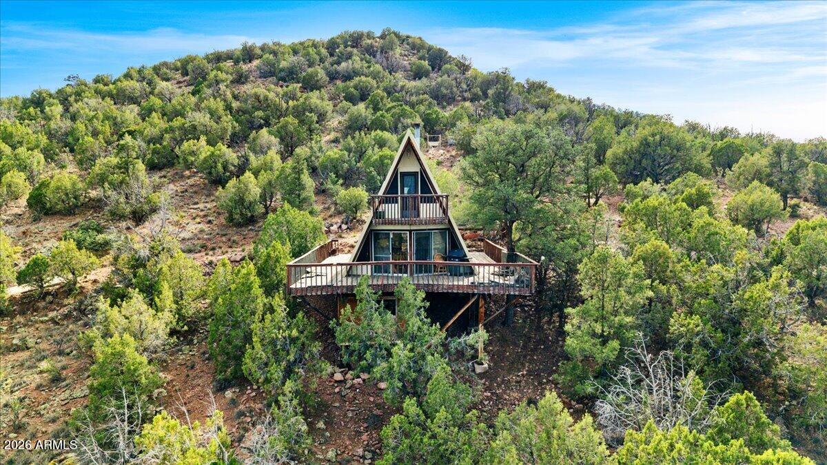 Discover a rare Northern Arizona retreat where wide-open space, privacy, and endless potential come together on an impressive 24.6-acre parcel. Set against breathtaking views of the San Francisco Peaks and surrounded by natural beauty, this unique property is ideal for nature lovers, investors, weekend adventurers, or those seeking an off-grid escape. The existing cabin offers character and a head start for your vision, whether creating a peaceful homestead, short-term rental, artist retreat, or future dream getaway. Enjoy stunning sunsets, star-filled skies, and room to expand, garden, add amenities, or simply enjoy the land. Conveniently located near Grand Canyon National Park, Flagstaff, Williams, and Sedona, this is a rare chance to own usable land with scenery, freedom, and upside.