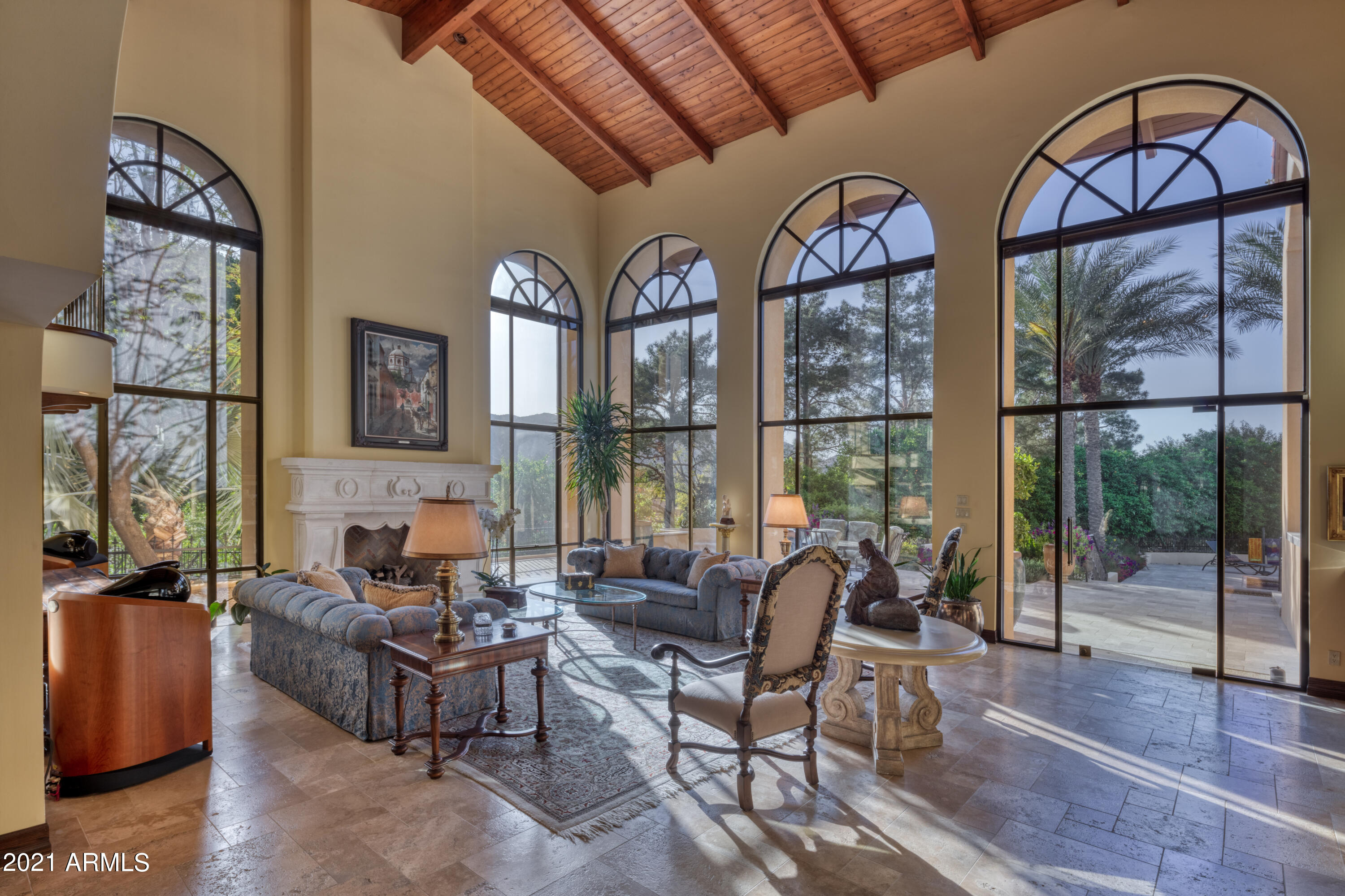 Incredible quiet, cul-de-sac location right on Mummy Mountain with one of the most stunning backyards in PV: Huge entertainment areas both covered + uncovered, Outdoor Kitchen, Wetbar, BBQ, Fireplace, Putting Green, Beautiful Pool, Spa + fire/water feature. This 2011 Cal Christiansen REMODELED Estate exemplifies elegance + sophistication with 23 FT HIGH ARCHED WINDOWS, hand-carved stone fireplaces with herringbone brick interiors, + French limestone flooring in a Versailles pattern. The Chef's kitchen opens to inviting Family Room with Oak floors adjacent to a separate Club/Game room. This home provides plenty of room with 5 large bedrooms, including the Master with 2 spacious closets, 2 separate offices, 7 baths, 4 car garage + intimate spaces to host events/gatherings both large + small.