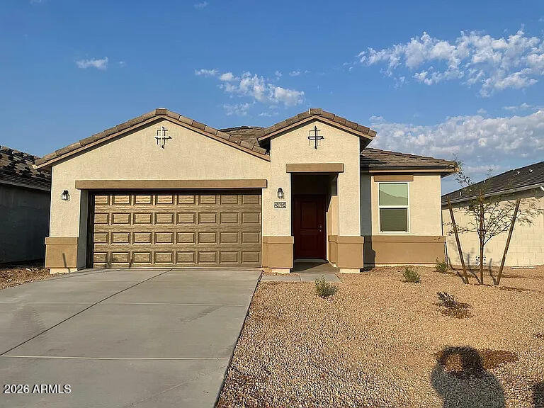 Welcome home to this charming single-level 3-bedroom, 2-bath residence in the growing community of Florence! Designed with comfort and functionality in mind, this home features an open-concept floor plan that seamlessly connects the living, dining, and kitchen areas, making it perfect for everyday living and entertaining. The spacious primary suite offers a private retreat with an en-suite bathroom and walk-in closet, while two additional bedrooms provide plenty of space for family, guests, or a home office. Enjoy the convenience of single-level living, a low-maintenance yard, and an attached garage. Ideally located near parks, schools, shopping, dining, and easy access to Hunt Highway, this move-in-ready home offers the perfect blend of comfort, convenience, and value.