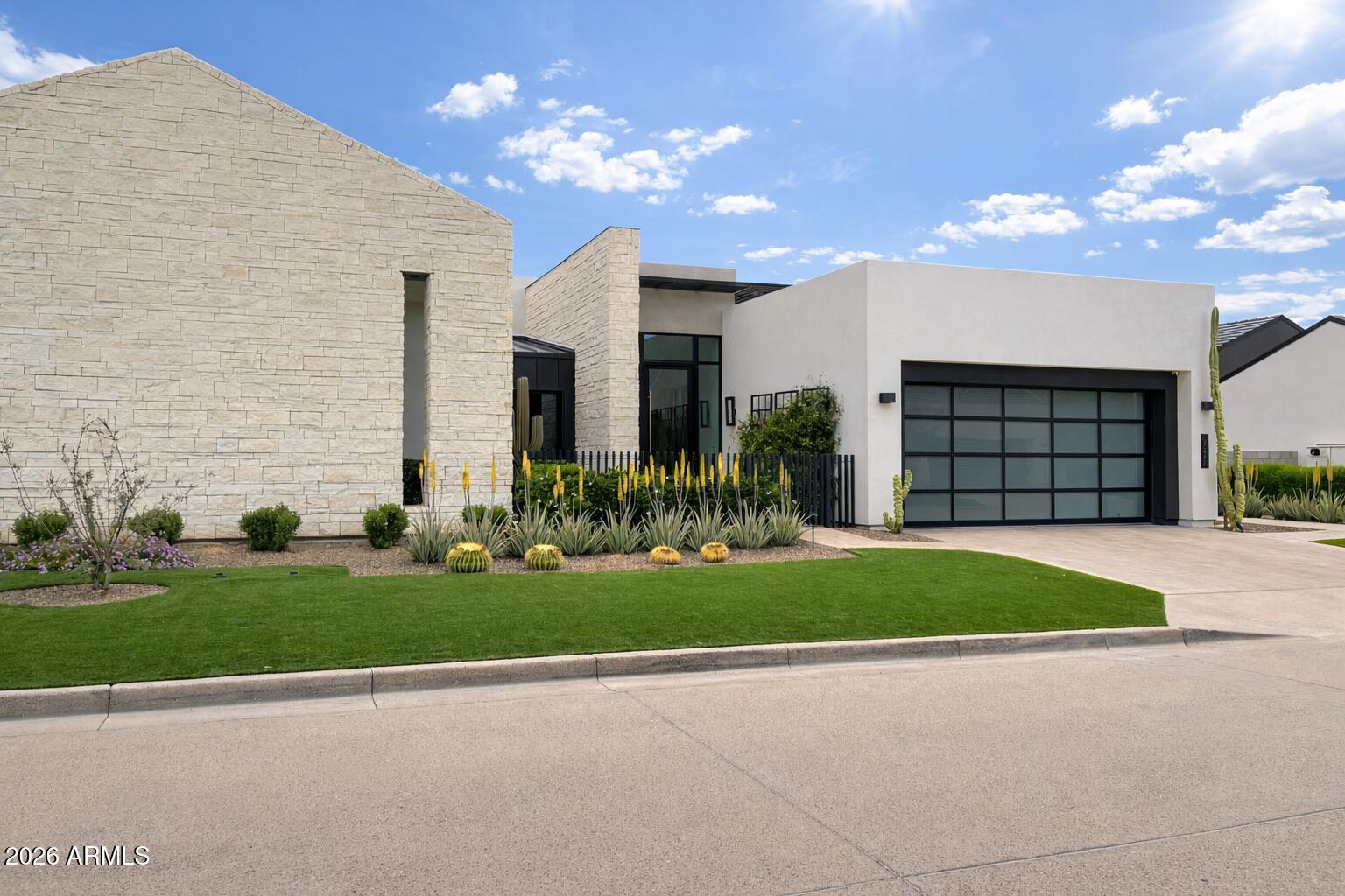 Set within the prestigious gated enclave of Azure , this exceptional single-level residence presents one of the most compelling value opportunities currently available in the community.

Fabulous single level floorplan,designed for both everyday livability and elevated entertaining, the home offers a private den, four ensuite bedrooms, four-and-a-half baths, and a detached guest casita.

At the center of the home, a beautifully appointed chef's kitchen is complemented by an expansive butler's kitchen-creating a rare dual-kitchen layout that elevates both functionality and entertaining. 

Discreetly positioned behind the main kitchen, the back kitchen features a wine refrigerator, coffee bar, and warming drawer; allowing the main space to remain pristine while hosting.

Walls of glass flood the interiors with natural light and create a seamless connection to the outdoor living spaces. The great room is anchored by a sleek fireplace, while expansive sliding doors open to a private, resort-inspired setting.

The backyard is designed for effortless enjoyment, featuring a sparkling pool and spa, outdoor kitchen, and fire feature-perfect for relaxed evenings and intimate gatherings without the maintenance of a large estate.

Additional highlights include custom closet systems, electric shades, an integrated Savant smart-home and audio system, and a three-car tandem garage with built-in storage.

Offering lock-and-leave convenience, curated designer finishes, and a highly desirable single-level layout, this home stands out as a an unbelievable opportunity within Azure-NOW OFFERED AT THE LOWEST PRICE PER SQUARE FT IN THE COMMUNITY!