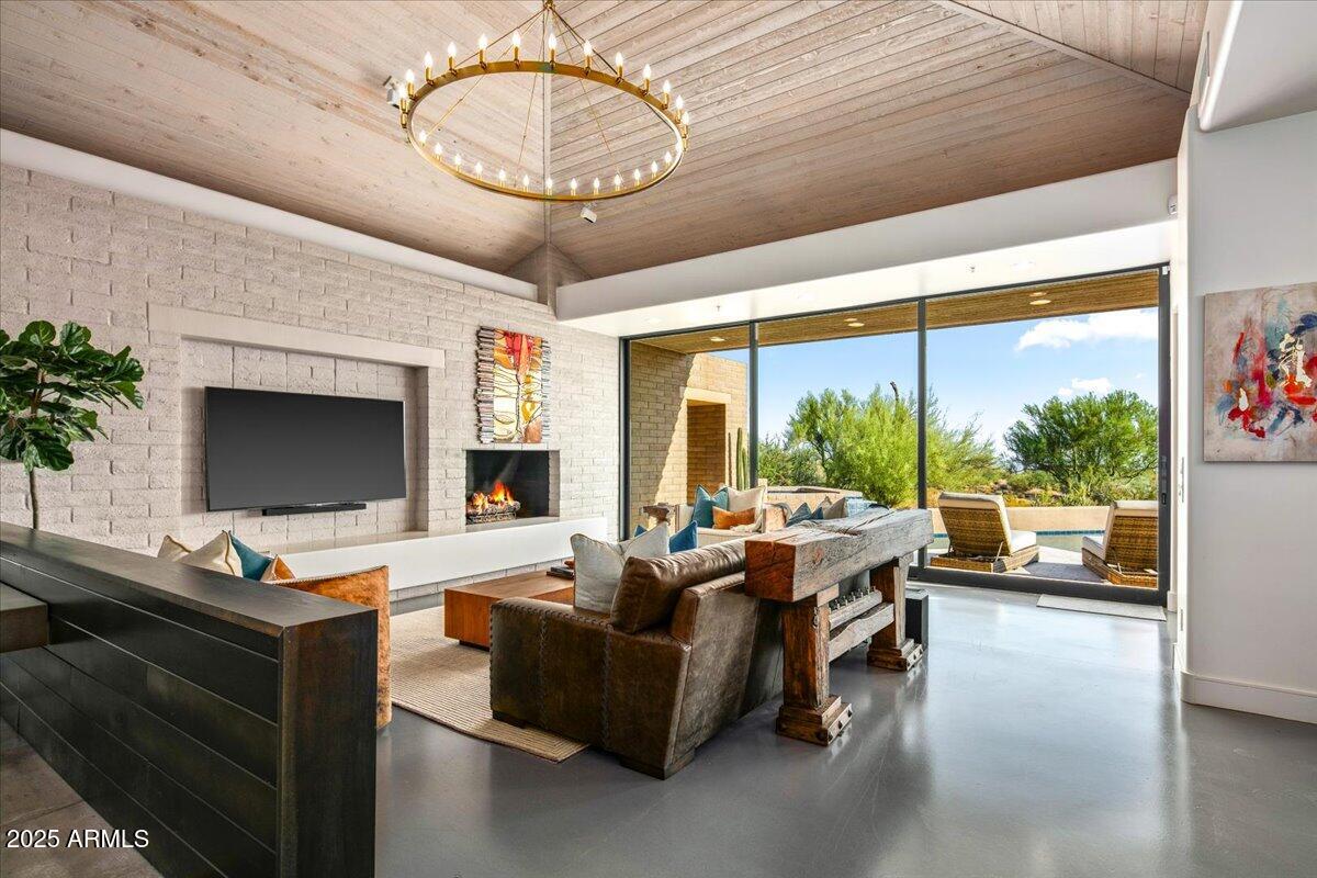 Awaken to sweeping desert vistas where Pinnacle Peak, sparkling city lights, and Apache's 4th fairway come together in a private, turnkey sanctuary—uniquely positioned with open space on both sides for ultimate serenity. Step into a completely reimagined farmhouse-contemporary retreat, thoughtfully designed for seamless entertaining and everyday comfort. At the heart of the home, a striking wood-and-granite island anchors the gourmet kitchen, surrounded by dove-gray cabinetry and a soft, cloud-hued backsplash—creating a refined yet tranquil ambiance.
All guest suites are smartly separated to ensure privacy, while the open-concept living spaces flow effortlessly to a south- and southwest-facing patio—ideal for enjoying sunsets, city lights, and the ultimate indoor-outdoor lifestyle. The backyard oasis features a sparkling pool and spa, fireplace, built-in BBQ, and brand-new travertine pavers.  Please refer to the documents section for a complete list of recent updates.
This is truly a must-see property!