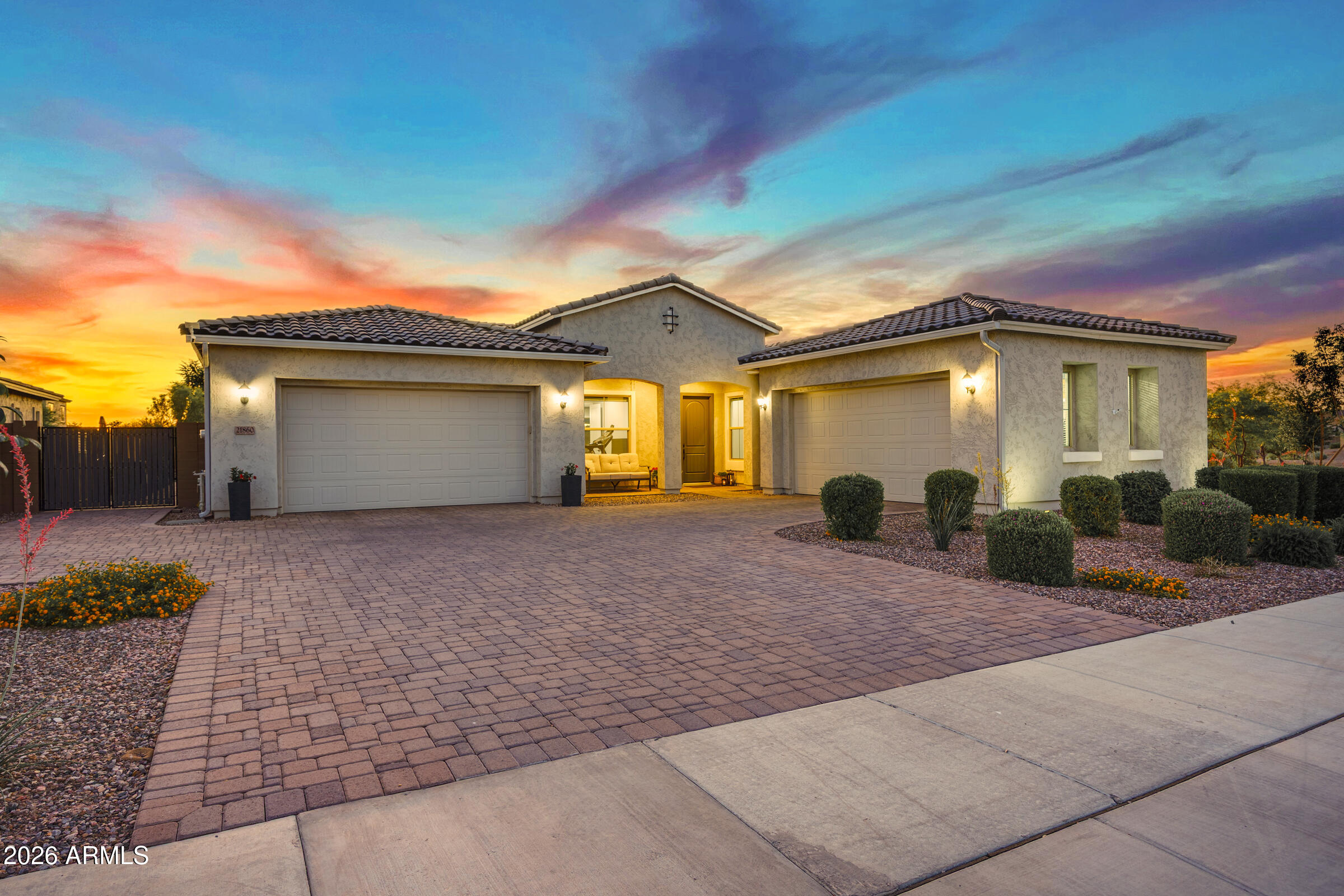 Turnkey luxury on one of Legado's most private lots. This 2024 Taylor Morrison single-level home sits on a premium 11,000+ sqft homesite backing to the community wash -- no rear neighbors, no north-side neighbors, just unobstructed privacy and open desert views. The sellers invested over $312,000 in combined upgrades: $147,000 in builder options (on top of base price and lot premium) plus $165,000 in post-closing improvements. For perspective, the builder's base price alone has risen $73,000 since 2023, with lot premiums and option pricing also climbing -- making this home a significant value versus building new today.
The resort-style backyard features a travertine paver pool deck, sparkling pool with raised water feature, both pool heater AND chiller for year-round comfort, a covered pergola with ceiling fan and built-in BBQ, and mature landscaping throughout, ready for entertaining from day one.
Inside, the gourmet kitchen is the centerpiece: GE Monogram 36" gas cooktop with double ovens, dark shaker cabinetry with soft-close dovetail drawers, quartz countertops, geometric tile backsplash, stainless steel hood, walk-in pantry, reverse osmosis, and oversized island with breakfast bar seating. Additional builder upgrades include Level-G tile flooring, custom master shower tile to 84", Santa Fe drywall finish, two-tone paint, 12-foot multi-slide door at the great room, raised panel interior doors, under-cabinet LED lighting, whole-house water softener, insulated 4-car garage with keyless entry, RV gate, and extended cabinetry at the laundry and entry hall.