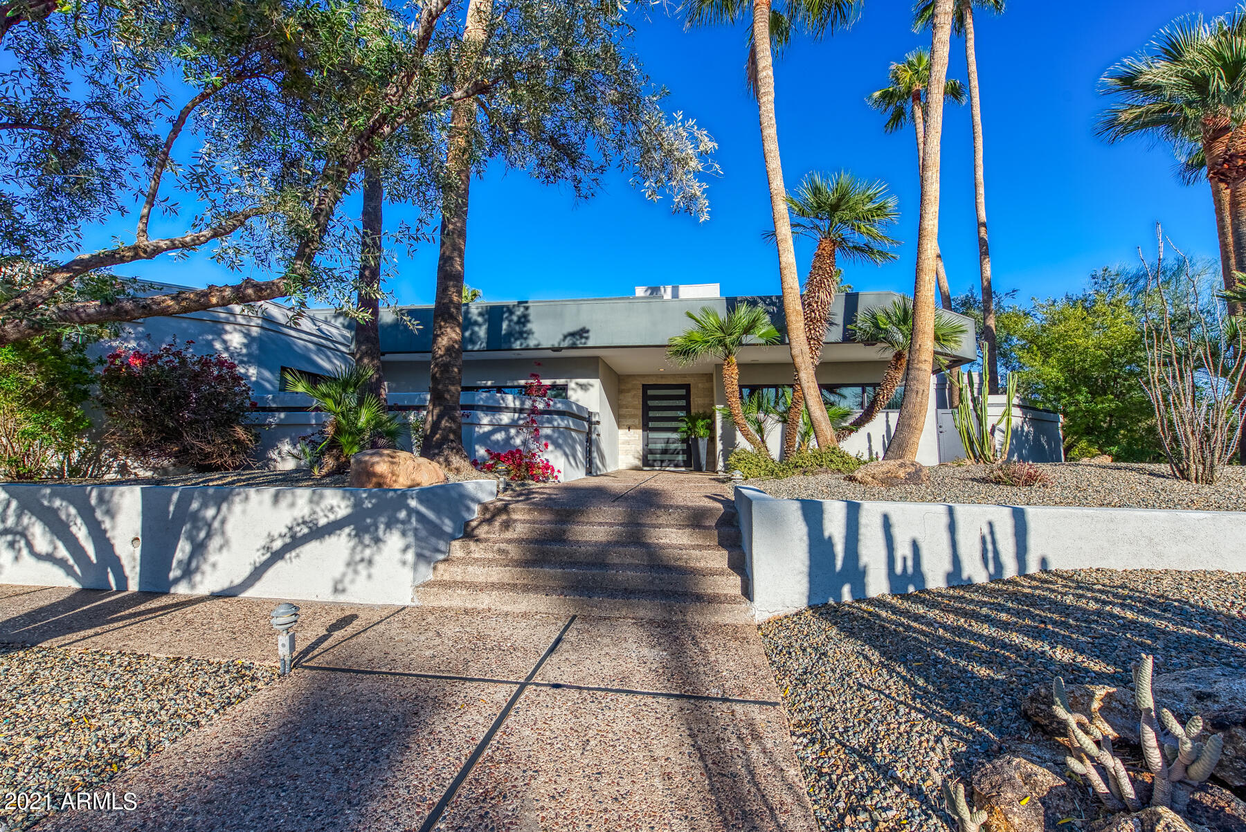 If you seek JOY, you will find it HERE. A modern great room floor plan completely rebuilt in 2020. Designed for living  your BEST LIFE, indoors and out! Your zest for entertaining will thrive on this private corner lot, loaded with opportunity to showcase drama in the home theater, challenge at the Bocce Court, Putting for dough and dipping in the azure pool after a hike. Friends, Fun, Family, is built into every inch of this spectacular home! 4 New AC units, wine cooler unit on roof, nothing overlooked! Let's play!