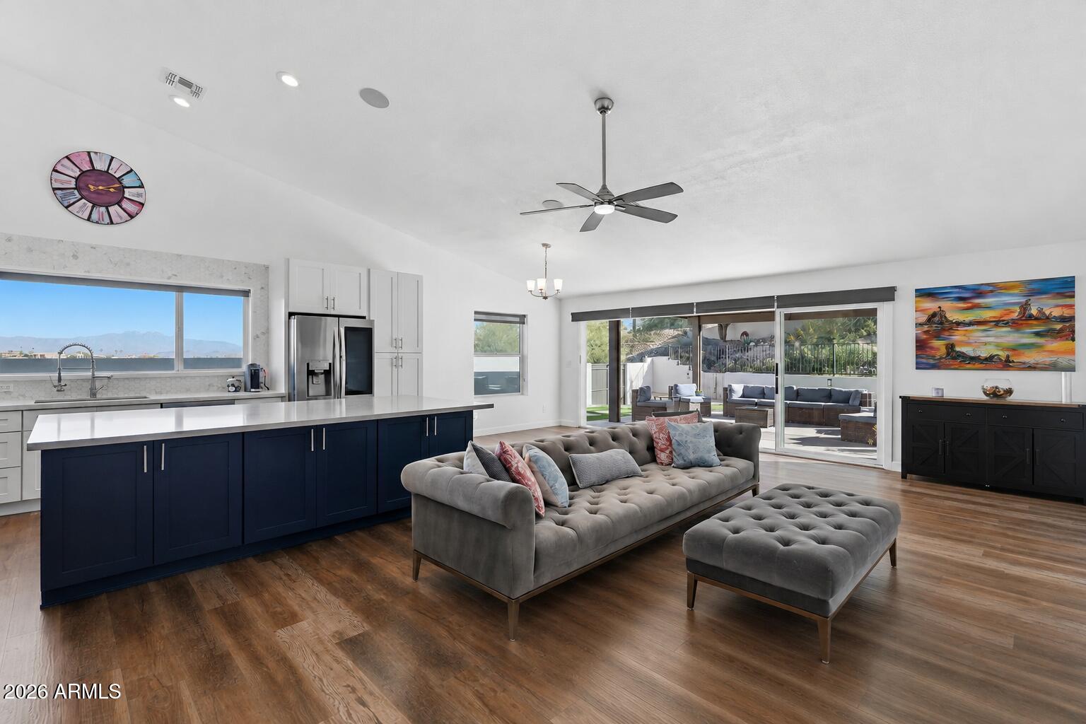 Fully renovated in 2023, this Fountain Hills property offers a single-level main home with stunning Four Peaks views and an attached upstairs guest house for added flexibility. The open-concept layout features a designer kitchen with an oversized island, modern finishes, two living areas, dedicated dining space, and an electric fireplace. Floor-to-ceiling glass walls open to a professionally landscaped backyard in 2025 with turf, pavers, and a pergola, for seamless indoor-outdoor living. 

The attached guest house, completed in 2024, provides ideal accommodations for guests or multi-generational living with a private entrance, kitchenette, full bath, and view patio. Total living area is 2,932 sq ft (per appraiser) including the 3-bedroom, 2-bath main home (2,360 sq ft) and 1-bedroom, 1-bath guest house (572 sqft).