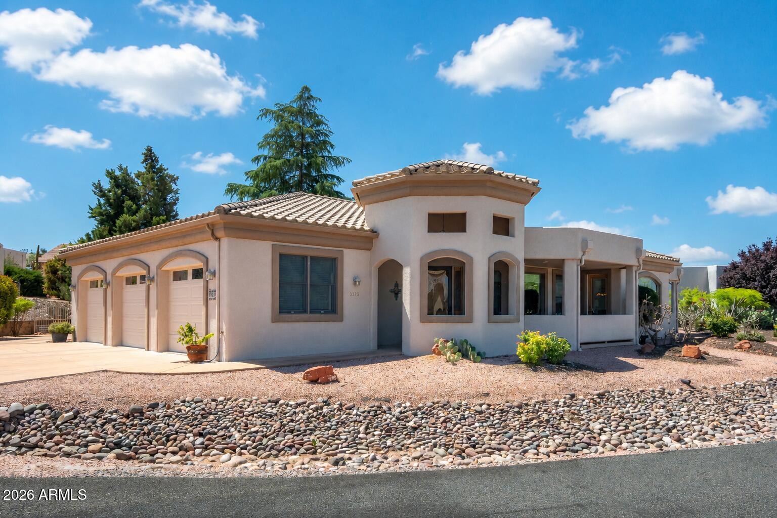 Nestled on a Premium Corner lot in the Desirable Verde Santa Fe community of Turnberry Estates, this beautifully maintained home offers stunning curb appeal and exceptional privacy. The spacious split-floorplan features generously sized living areas that offer an abundance of natural light. Large kitchen opens to the great room, making it ideal for entertaining. Relax in the primary suite complete with a spa-like bath, soaking tub & fireplace. Enjoy Arizona living year-round in the peaceful park like backyard with mature landscaping & multiple outdoor sitting areas. 3-car garage provides plenty of room for vehicles, storage or hobbies. Conveniently located near golf, wineries, hiking, dining & all that the Verde Valley has to offer. Move-in ready and waiting for you to make it home.