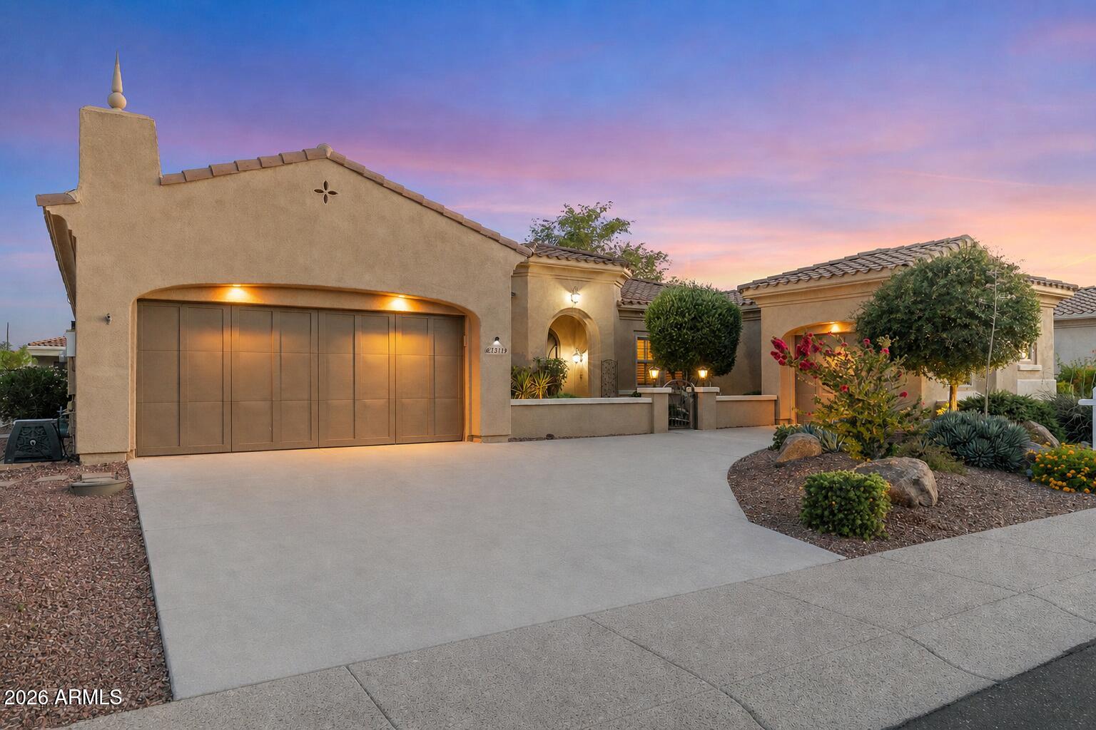Welcome to luxury living in the highly sought-after gated 45+ community of Corte Bella Country Club! Nestled on a quiet, private street, this elegant Granada model with a rare 3-car garage offers the perfect blend of comfort, style, and functionality. Step inside to discover a beautifully upgraded interior featuring 18'' diagonal tile, plantation shutters, crown molding, fresh paint throughout and custom stone niches that add warmth and character throughout. The chef's kitchen is designed to impress with granite countertops, 42'' staggered cabinetry, double ovens, gas range, Blanco sink, and a convenient butler's pantry, ideal for both everyday living and entertaining. The spacious primary suite is a true retreat, showcasing custom tile work, dual sinks, a snail shower, large walk-in closet, and private patio access. Additional highlights include an updated powder room, remodeled Jack & Jill bath, central vacuum system, water softener, and solar! Enjoy Arizona living at its finest in the expansive covered patio with pavers, complete with a built-in BBQ and firepit, perfect for entertaining or relaxing year-round. Recently painted exterior adds to the home's pristine curb appeal. This is a must-see opportunity in one of Sun City West's premier communities!