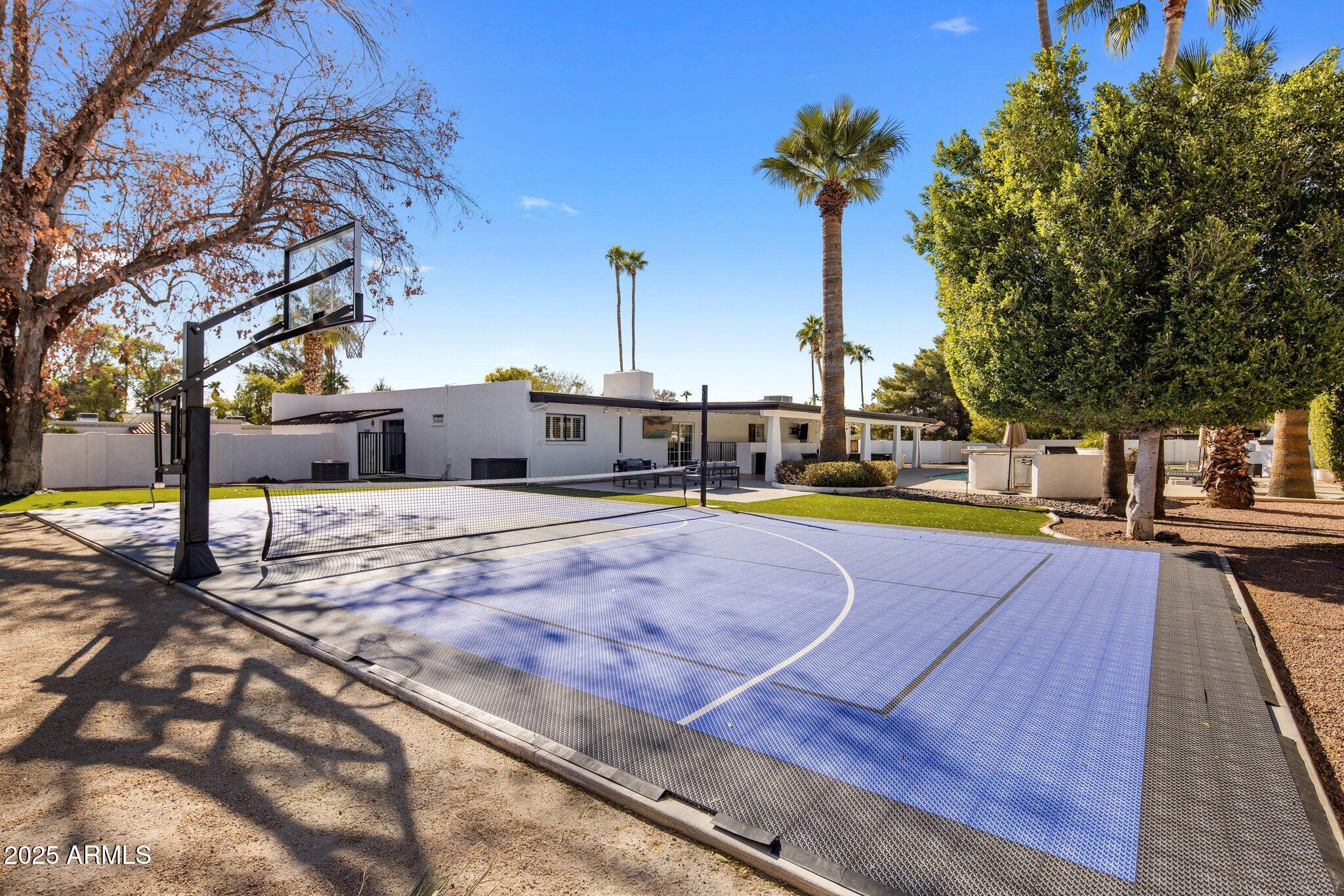 Unique Scottsdale opportunity offering the ideal combination of location, lifestyle, and investment potential. Situated on a large lot just minutes from Kierland, Scottsdale Quarter, world-class golf, dining, and entertainment. This 6-bedroom, 4.5-bath residence is perfectly suited as a primary home, vacation retreat, or income-producing property. Designed to accommodate larger groups, the home features spacious bedrooms, dual primary suites, a game room, theater room, wet bar, and multiple fireplaces, creating an ideal setting for entertaining and guest enjoyment. The resort-style backyard is a destination unto itself, complete with a heated pool and spa, sport court, putting green, outdoor fireplace, built-in BBQ, and multiple outdoor gathering spaces.
