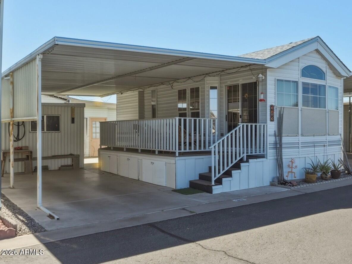 HOME WARRANTY INCL 1-bed park model in Caliente Casa de Sol offers approximately 385 sq ft of well-designed living space w/vaulted ceilings & 2 skylights that enhance the bright, open feel. Multiple windows, dbl-pane Low-E provide abundant natural light. Wood plank flooring installed 2018, w/carpet in bedroom. Home has clean, well maintained interior. Kitchen features lots of cabinet storage, smooth-top range installed 2020, built-in microwave, & home furnished for added convenience. Bathroom received a major upgrade in 2024 w/tiled walk-in shower. Outdoor living is inviting w/covered deck, front & rear stair access, built-in storage drawers beneath deck for extra space. Exterior features sun screens, 8x10 storage shed, covered carport w/privacy panels, & pitched roof w/new roofing in 2022 Residents of this popular 55+ active adult community in Florence enjoy a vibrant lifestyle with resort style amenities, social events, and recreational activities designed for active living in the Arizona sunshine.

Caliente Casa de Sol 55+ active adult community in Florence is known for its welcoming atmosphere and wide range of amenities that make everyday living feel like a vacation. Residents enjoy access to a heated community pool and spa, fitness center, and beautifully maintained clubhouse that hosts social gatherings, events, and community activities throughout the year.

The community also offers pickleball courts, shuffleboard, billiards, and organized clubs that make it easy to stay active and connect with neighbors. Scenic walking paths and outdoor gathering areas provide relaxing spaces to enjoy Arizona's warm weather.

Caliente Casa de Sol is conveniently located in Florence, Arizona, with nearby shopping, dining, golf courses, and local attractions just a short drive away. The community is designed for comfortable, low maintenance living while offering an active social lifestyle that many residents seek in a 55+ community.

Living in Caliente Casa de Sol Florence AZ provides the perfect blend of recreation, relaxation, and community connection in a desirable desert setting.