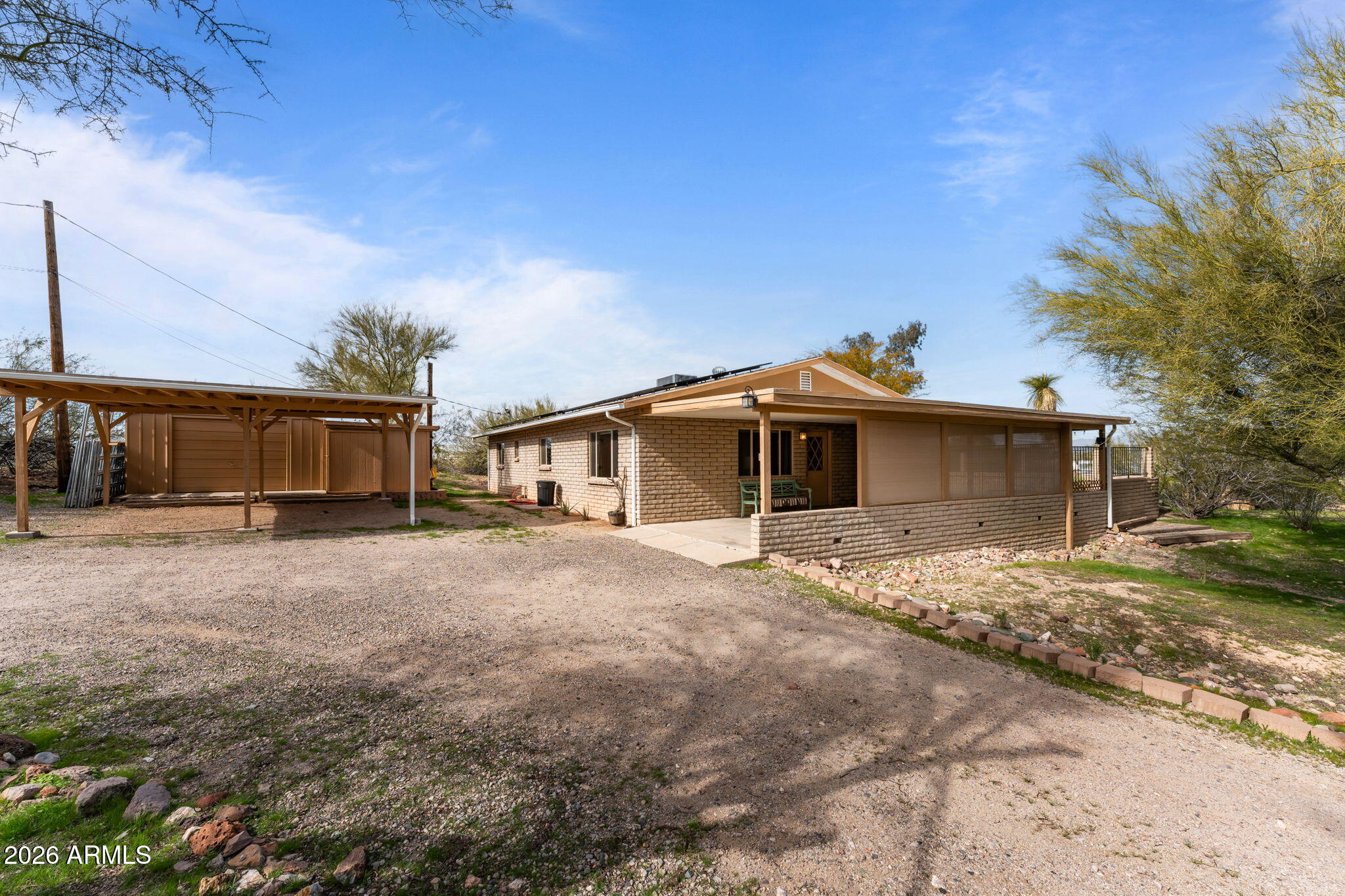 Recently remodeled slump block home on a quiet in-town hillside lot offering both comfortable living and excellent investor potential. Set on .41 acres with mountain views, this home is truly move-in ready. Tile flooring throughout, and a bright open layout create a welcoming feel. Updated kitchen with hickory soft-close cabinetry, granite countertops, breakfast bar, large deep sink, quality appliances, and oversized dining area. All appliances included.
Primary bath features a newly tiled walk-in shower with pebble flooring. Energy-efficient solar panels help reduce utility costs, with annual credits to the homeowner. Private covered patios, fenced landscaped area, circular driveway, covered parking, and large storage building. Minutes to historic downtown, dining, and roping arenas. Kitchen fully remodeled 2014. Plumbing partially updated 2014. Heating and cooling system updated 2014. Bathrooms fully remodeled 2016. Flooring partially updated 2016. Roof partially updated 2016. Electrical wiring fully updated 2018. ENERGY STAR dual-pane windows installed. Solar panels installed (utility-owned).