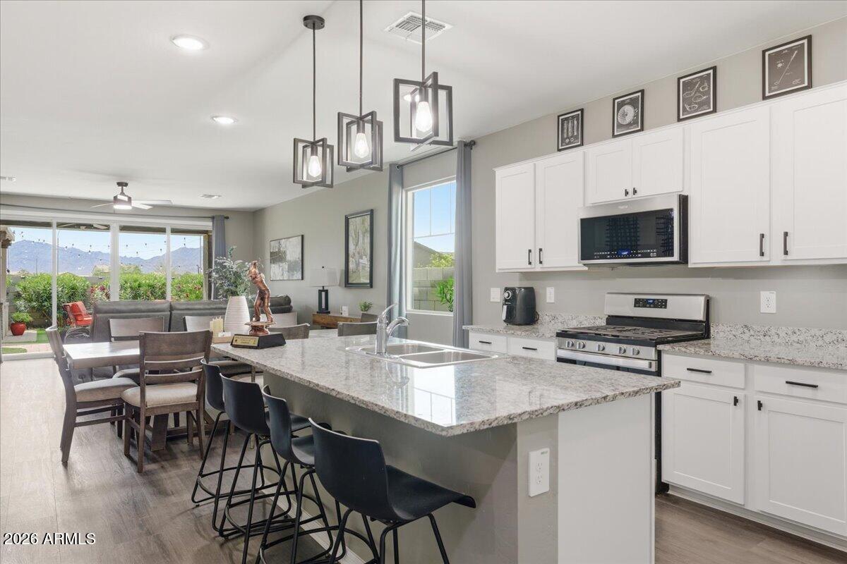 Mountain Views, built in Outdoor Kitchen, outdoor hot tub 3 Bathroom, Den or 5th Bedroom home. Mountain views inside the Family Rm while sitting on the couch or from the bar stools at the Gazebo. Covered outdoor kitchen includes BBQ Grill, Side Grill, Ice Bucket, Refrigerator, TV Mount and Lights. Split floor plan-built Yr 2023 home w/ energy efficient features. Large Kitchen, Gas Range, Granite Countertops, island, under cabinet lighting, large walk-in pantry. What would your favorite meals be to serve at a Dining Table with backyard & mountain views? Designer accent walls at entry & behind the tv wall. Large Primary Bedroom, Primary bathroom two sinks, private toilet, large shower, large walk-in closet. Bedrooms are separate front bedroom with private bath & two bedrooms share a hall ba 4 Bedrooms OR make the separate Den a 5th Bedroom. Split Floor Plan. Home is Positioned near the scenic Estrella Mountains, this home delivers the kind of everyday backdrop buyers dream about. Inside, you'll find a thoughtfully designed split floor plan that creates privacy and flow. Ideal for families, guests, or remote work setups.
One of the standout features that immediately sets this home apart is the rare three full bathrooms. This is a game-changer for busy households, multi-generational living, or anyone who values convenience and personal space.
Step outside and the lifestyle really comes to life.
The professionally landscaped backyard is built for entertaining. Picture weekend gatherings, evening dinners under the Arizona sky, or simply unwinding after a long day. This is not just a backyard. It's an experience.
Located in the growth cooridor of Tolleson Arizona, you're surrounded by growth, opportunity, and connectivity. Easy access to major corridors like I-10 means commuting into Phoenix Arizona is seamless, while still enjoying the peace of suburban living.
Many will appreciate proximity to schools within the Tolleson Union High School District, along with nearby charter and STEM-focused options like BASIS Charter Schools and Great Hearts Academies, known for strong academic performance and innovation.
Outdoor enthusiasts will love being minutes from Estrella Mountain Regional Park, offering hiking, biking, and endless Arizona sunsets.
Why buyers love newer homes in Tolleson:
" Energy-efficient construction means lower monthly costs
" Modern layouts designed for real life and remote work
" Strong appreciation potential in a rapidly expanding area
" Access to new infrastructure and future freeway development
This home speaks directly to buyers who want more than just a place to live. They want a lifestyle upgrade.
If you've been searching for a home that balances space, style, and long-term value in the West Valley, this is your opportunity.
 
10819 W Marguerite Ave, Tolleson, AZ 85353
Home Highlights:
" Modern newer construction
" Functional split floor plan
" 3 full bathrooms (rare and highly desirable)
" Open-concept living spaces
" Abundant natural light
" Designed for gathering, living and entertaining
Outdoor Living:
" Professionally landscaped backyard
" Entertainment-ready outdoor space
" Low-maintenance design
" Perfect for gatherings, relaxation, and Arizona evenings
Location Benefits:
" Minutes to I-10 for easy commuting
" Close to Phoenix Arizona and West Valley hubs
" Near Estrella Mountain Regional Park
" Growing community with strong appreciation potential
Schools & Education:
" Tolleson Union High School
" University High School
" Charter & STEM options:
o BASIS Charter Schools
o Great Hearts Academies
