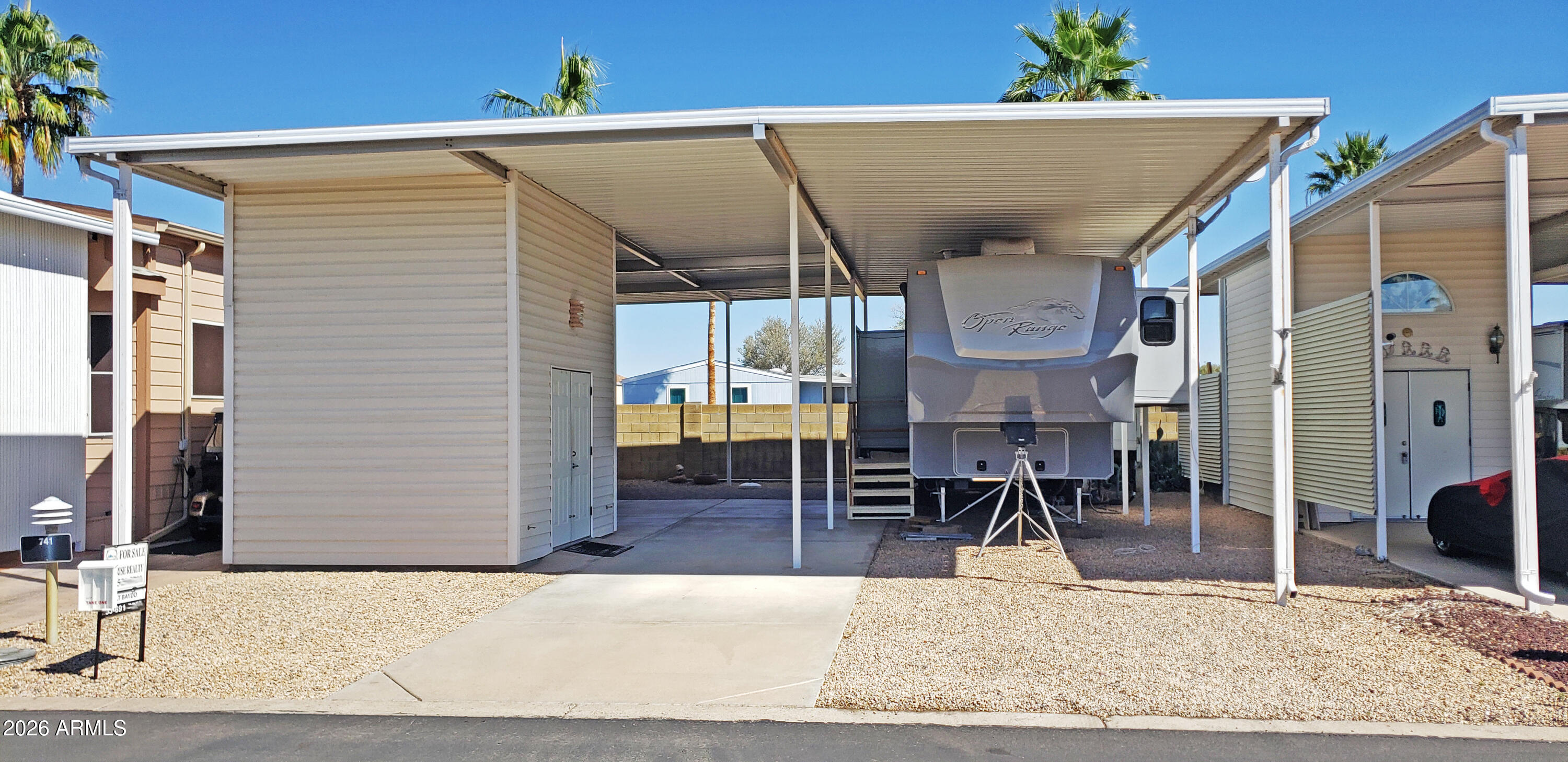 Happy Trails RV Lot complete with Full Awning and Casita Shed. Great location backed up to a common wall providing extra privacy. Full height awning accommodates most all RV styles and size. Full hook-ups include water, sewer, 50amp power, cable and phone. Happy Trails rules and regs allow for a host of customization including adding a park model or manufactured home or custom build your Casita Home to preserve use of the RV Port. Casita shed has refrigerator, washer/dyer and pull down access to the storage / loft above. Come make this one yours and start living the best RV Resort life. An affordable HOA fee includes unmetered water, garbage service and full access to the many amenities. Happy Trails Resort is a very lively 55+ Gated Community highlighted by Pickleball & Tennis Courts, Multiple Pools and Spas, Fitness Center, a Host of Craft Clubs, and Restaurant. Lots of Live Entertainment and tons of get-togethers mean there's never a dull moment. Come see what the Happy Trails Lifestyle is all about!