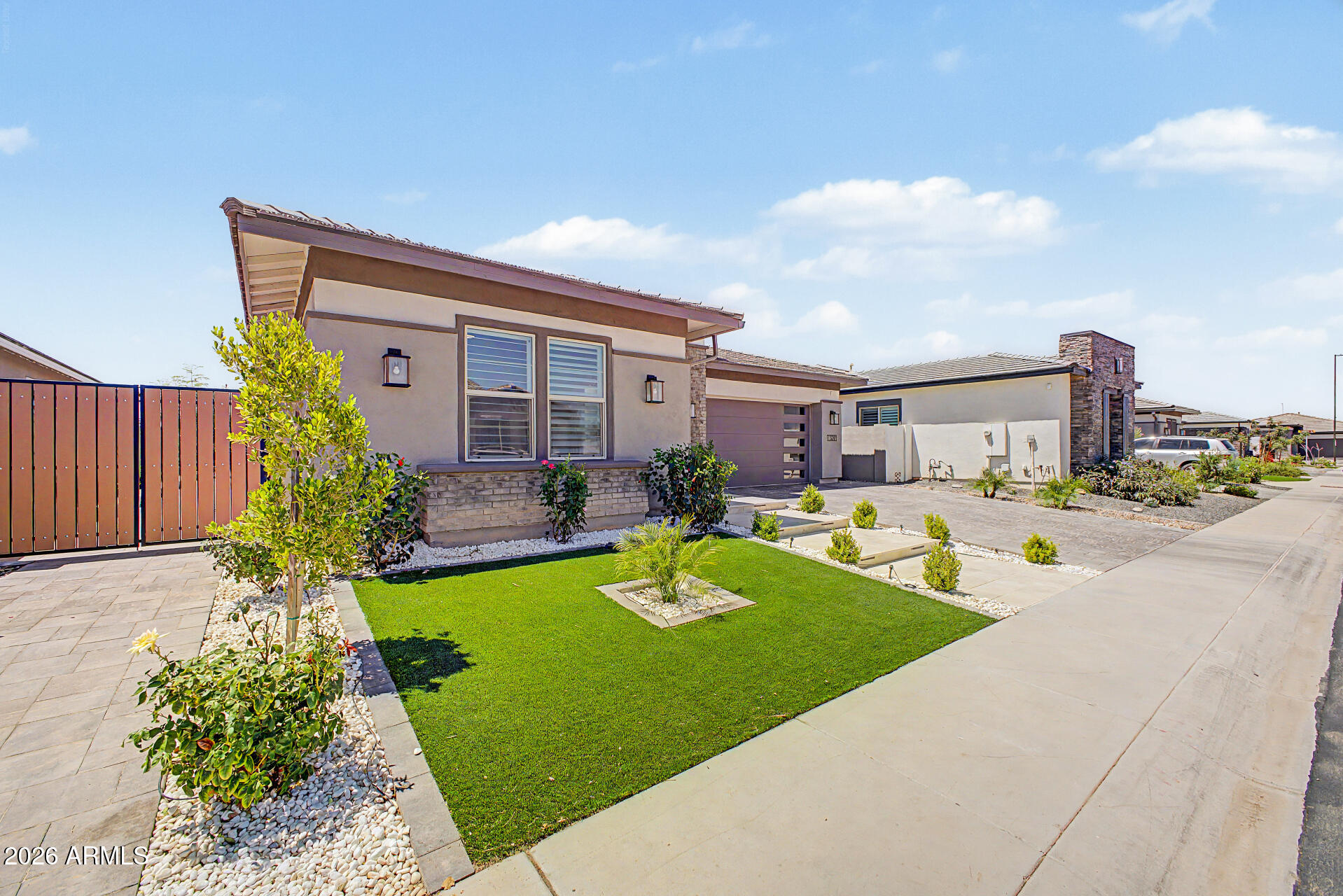 Beautiful gated community features recently built newer homes and a very nice community playground.  Home shows like a model with over $130,000 in upgrades.  2200 sq feet of tile added, kitchen remodeled 2025, Quartz counters, backsplash, lighting, game room cabinets and additional counter space and 4th bedroom with bonus room.  bathroom since and matching counter tops, garage flooring, water softener, shutters, side gate, concrete pillars, pavers etc. You are not likely to find this floor plan again. The  landscaping all set. Let's go see inside.