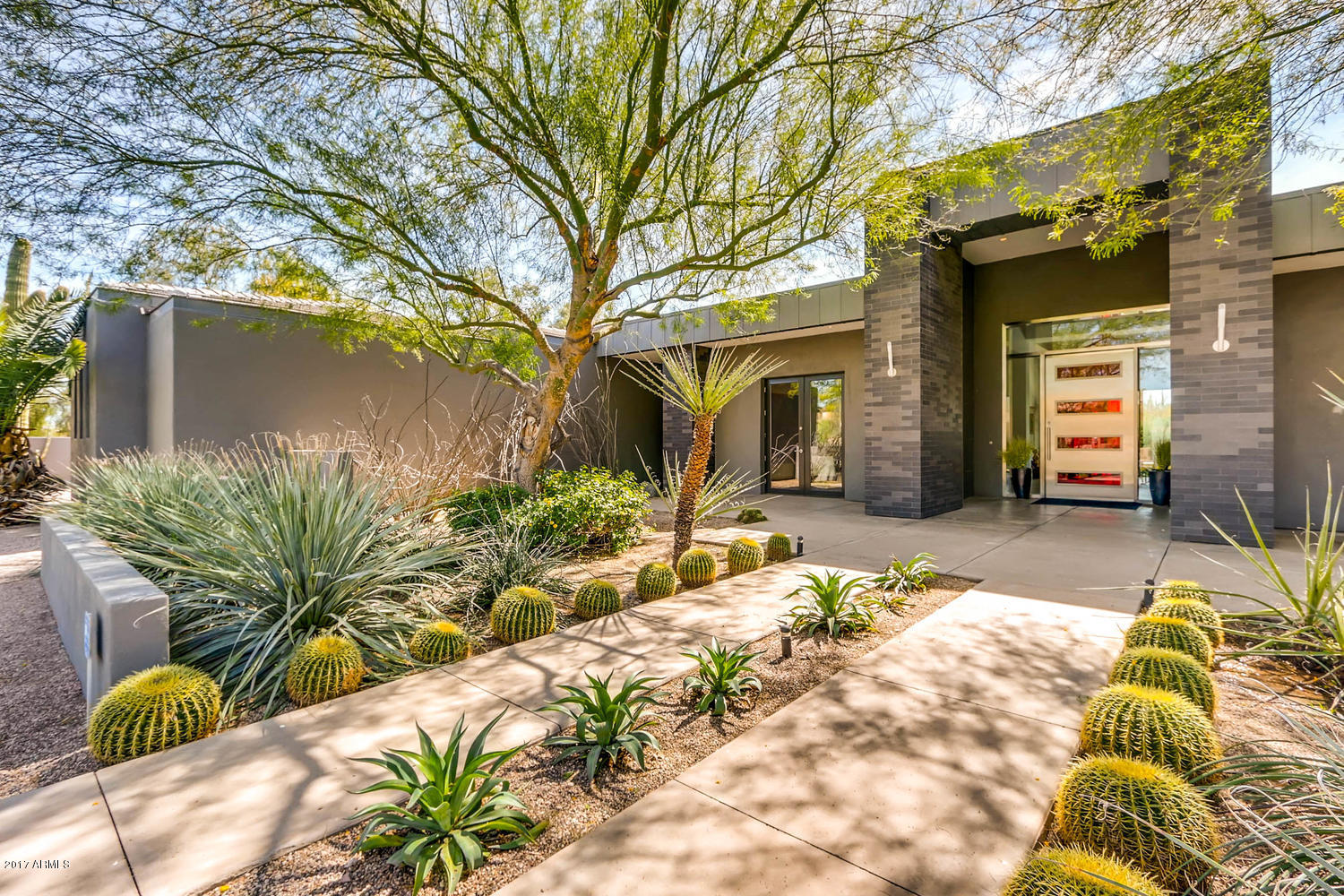One of a Kind! Chic contemporary home built for a family & entertaining! Main House boasts 6,375 sq ft: 4 bdrms+Office+Exercise rm. 4.5 baths. 4 car garage. All BRs are ensuite w/ walk-in closets. Bright & sunny open floor plan. Sleek gourmet kitchen w/ Zebra wood cabinets, Ceasar Stone counters,stainless steel backsplash, & Wolf/Subzero appliances that's open to large family rm w/ fireplace. Split floor plan w/ master & office plus bonus rm on kids wing. Home features include:Glass pocket doors for indoor/outdoor living, porcelain tile,Italian light fixtures, high ceilings, Bang & Olufsen audio/ visual. Master bdrm & bath w/ oversized his/her closets, indoor & outdoor showers w/ pebble finish. Resort like backyard w/ firepits,heated lap pool & spa.  Separate 484 sq ft guest house in back.