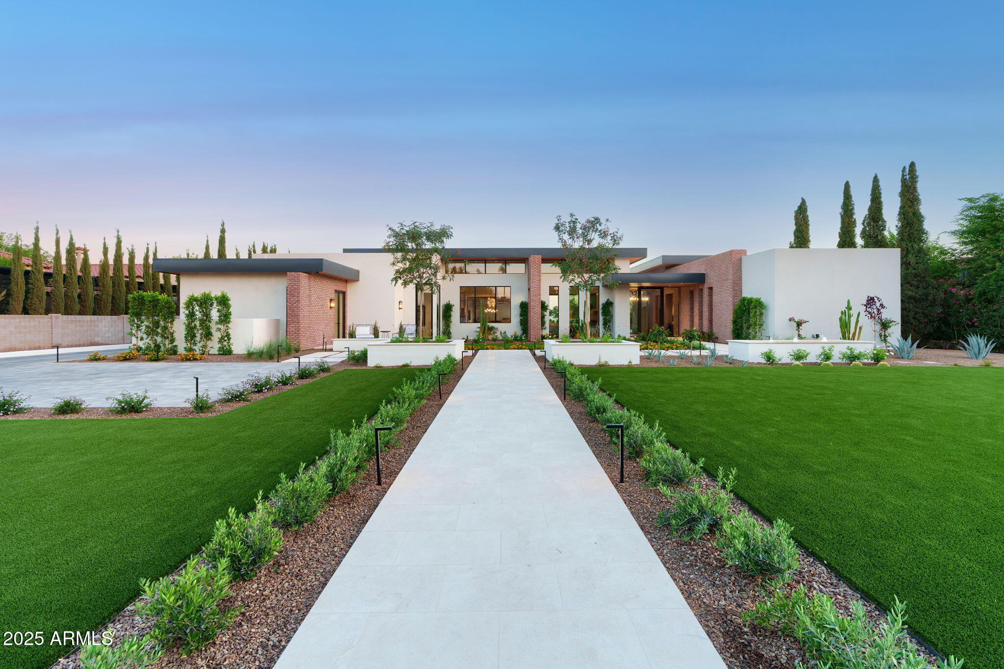 Nestled at the end of a peaceful cul-de-sac on almost an acre, this brand-new luxury estate offers modern design and unmatched functionality. Floor-to-ceiling windows/sliders flood the home with natural light, showcasing a gourmet kitchen with Wolf appliances, a prep kitchen on the side, an attached casita with its own living space and full kitchen! Resort-style pool, spa, outdoor kitchen, and space for a tennis or pickleball court. Oversized garage boasts 20x10 ft doors, fits RVs, boats with almost 2000 SQFT of storage space. An exercise room, Control4 smart system, AV throughout, and driveway that fits 10+ cars make this home perfect for upscale living, entertaining, and recreation. 6 bed, 6.5 bath, massive primary closet w/ Washer-Dryer all in the heart of Scottsdale Cactus Corridor.