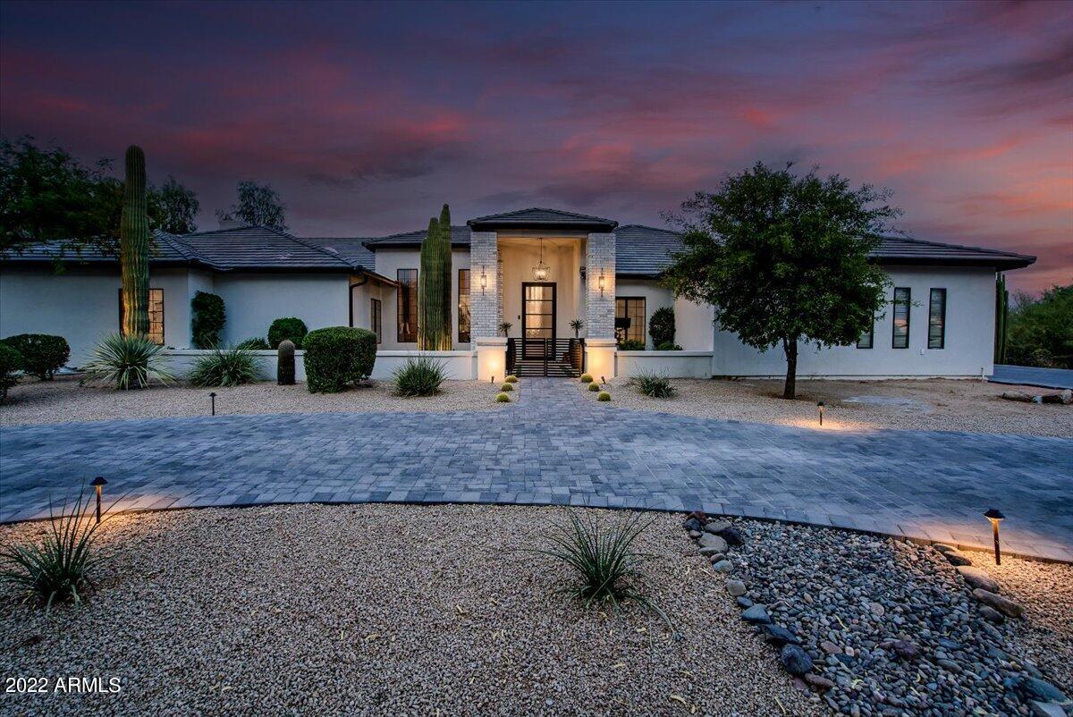 The highly anticipated Showstopper in Pinnacle Peak Estates everyone has been waiting for! Completely redesigned and re-engineered from the ground-up in 2022, Whispering Wind is in a league of its own! This fully reimagined custom home welcomes you to relax and unwind through the thoughtfully designed living areas, workout room, home office, and chef's kitchen worthy of a Michelin Star! Serving as the perfect complement to the main-living level, a gentle staircase ushers toward a perfectly appointed lower level retreat accommodating a spacious bedroom, bathroom, living room & kitchen-bar! 

Enhancing this home like a bow that wraps your favorite gift are soaring 20ft vaulted ceilings, accented wooden beams, hand-laid blonde oak hardwood flooring, modern steel fireplaces &... ...transitional living environments illuminate the path towards endless possibilities to entertain from the resort-style backyard! Brand new oversized heated pool adorned with Islamorada tiles, water-lined mosaic artistry and elevated hot tub with built-in pergola bring distant views of the McDowell Mountains within reach. 

Masterfully built outdoor BBQ-kitchen, pizza oven, kiva fireplace, warmly lit walkways and white-pine & hickory wood-burning fire pits playfully captivate just before a lucky shooting star flashes its brilliance across the midnight sky. What memories will you create...?