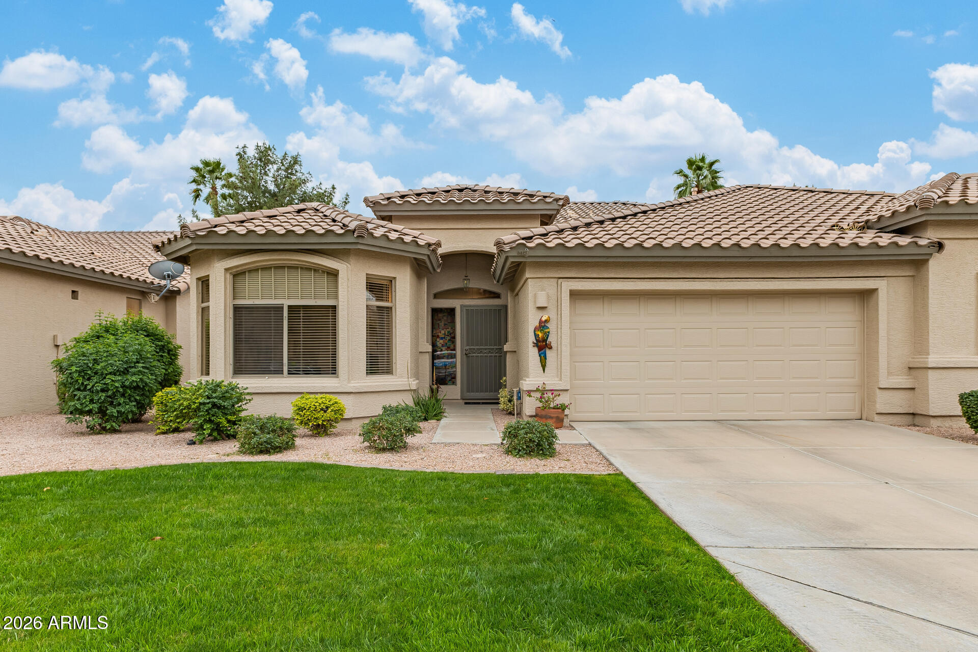 Welcome to resort-style living in the beautiful GATED, adult community of Oakwood in Sun Lakes! This immaculately updated 2 bed, 2 bath villa is bright, open, and move-in ready. The remodeled kitchen shines with maple cabinets, granite counters, high-end S/S appliances & sunny breakfast nook. Unwind on your private covered patio with spacious lush lawn views. Large primary suite offers dual sinks, his & her closets plus linen cabinet. You'll love the convenience of the indoor laundry room with additional cabinets. 2 car garage w built in cabinets & utility sink. So many updates on this villa! It's a MUST see! Close to clubhouse, walking paths, golf, tennis, pickleball, pools/spa, clubs, social activities & restaurants.