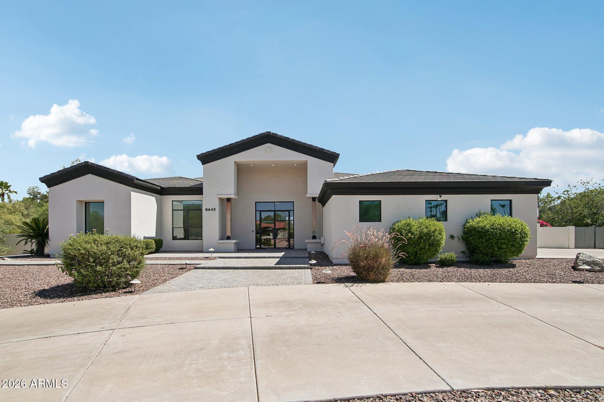 Reimagined Acre Estate in North Scottsdale!
Behind a custom iron front door sits a fully transformed 4-bedroom + den estate on a true 1-acre lot. In 2022, award-winning builder Temac Development took it down to the studs -- new roof, plumbing, wiring, kitchen, and baths throughout.

The chef's kitchen anchors an open floor plan with 9+ flat ceilings and zero interior steps. The split-wing primary suite features a spa-style bath with a jetted soaking tub, dual vanities, and a private toilet room.

Outside, the acre lot delivers true Arizona living: a sparkling pool, heated spa, sport court, built-in BBQ, and fire pit -- plus room to expand. 3-car garage, circular drive, RV gate. No HOA.