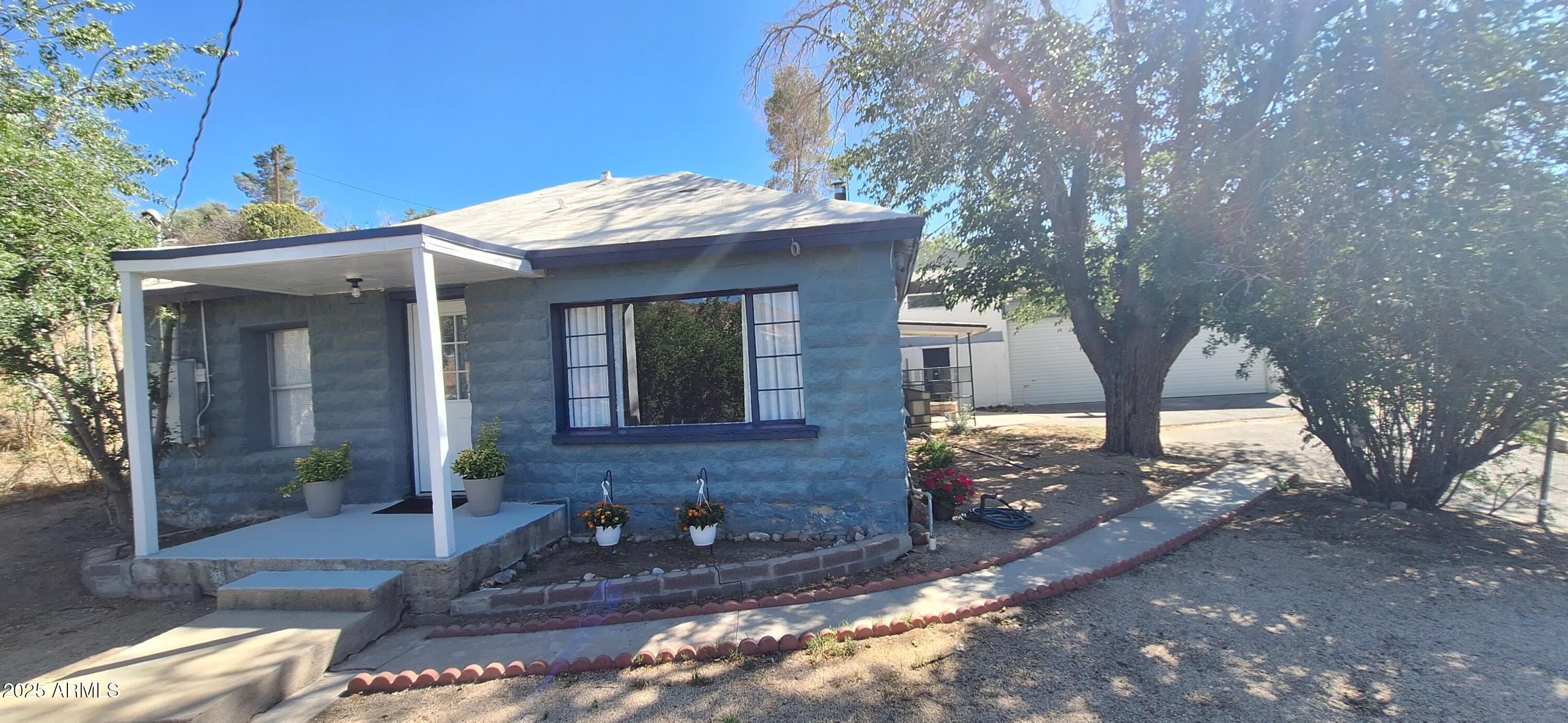 Charming Remodeled Home with Income Potential in Globe, AZ!
This inviting 2-bed, 1-bath home features new flooring and fresh paint, making it move-in ready. Enjoy a spacious detached garage ,a mechanic's dream, with an air-conditioned loft, perfect for a workshop or office, plus extra storage and a cellar. The property also includes a 1-bed, 1-bath casita with a full kitchen, private entrance, and separate address ideal for guests, extended family, or rental income. Located in historic Globe, just 90 minutes from Phoenix, this home offers small-town charm with scenic beauty and outdoor recreation. A rare find with flexibility and value!