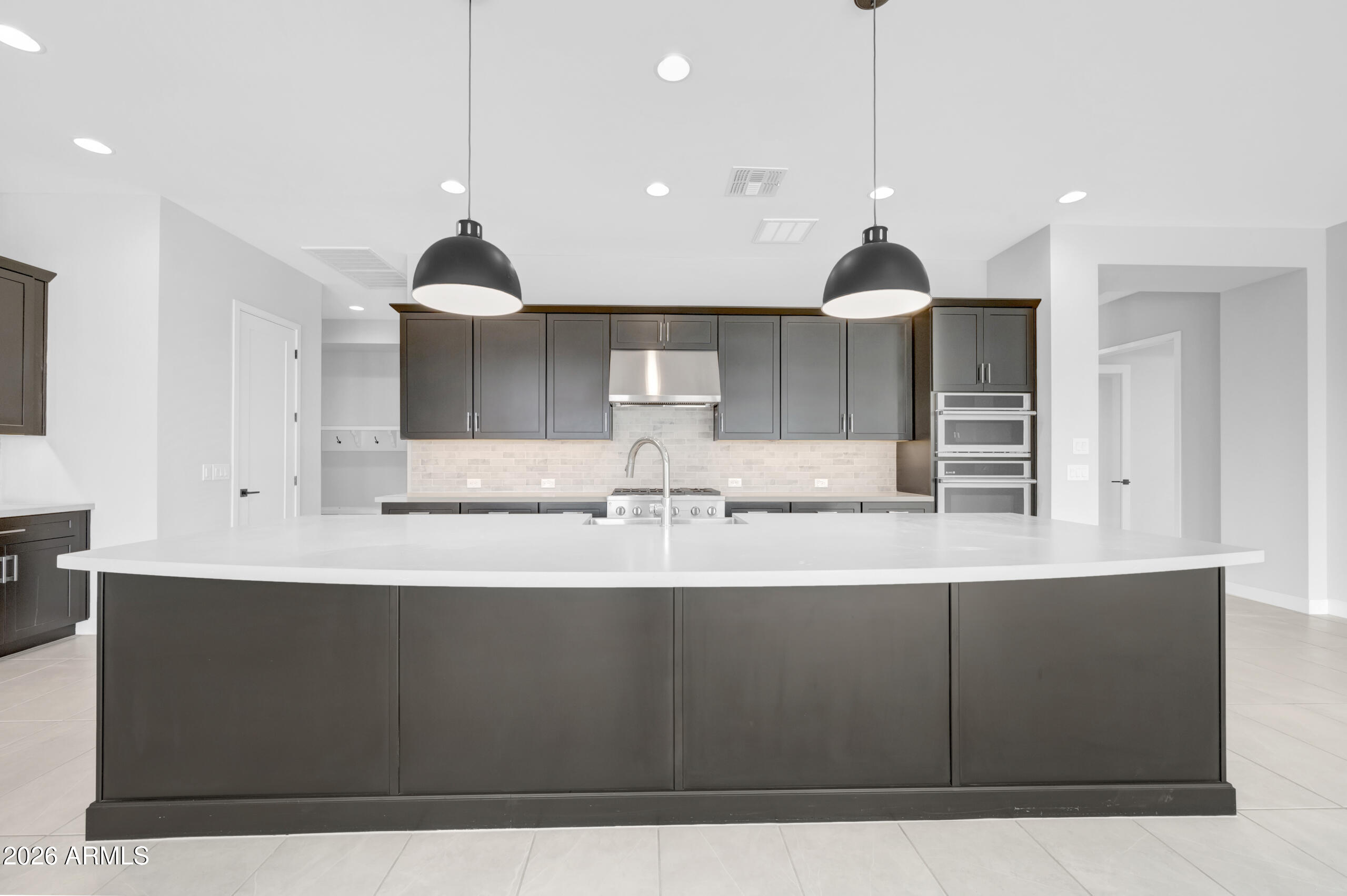 BRAND NEW 3336SF single level with 3 ensuite beds, an enclosed study, retreat, extensive backyard covered living area and split 3 car garage on 10,551SF homesite in 55+ Victory; open plan with huge energy efficient windows and 16' sliding glass door opening to extended covered patio; 10' ceilings and 8' doors; gourmet kitchen with GE Monogram appliances including 42'' Built-in refrigerator and gas rangetop;  large quartz island and gorgeous dark cabinets with custom tiled backsplash; quartz c-tops in all baths; upgraded tile, carpet and pad in all areas; 2-tone paint throughout; upper and lower cabs with sink in utility room; 2x6 construction and extensive new home warranty.