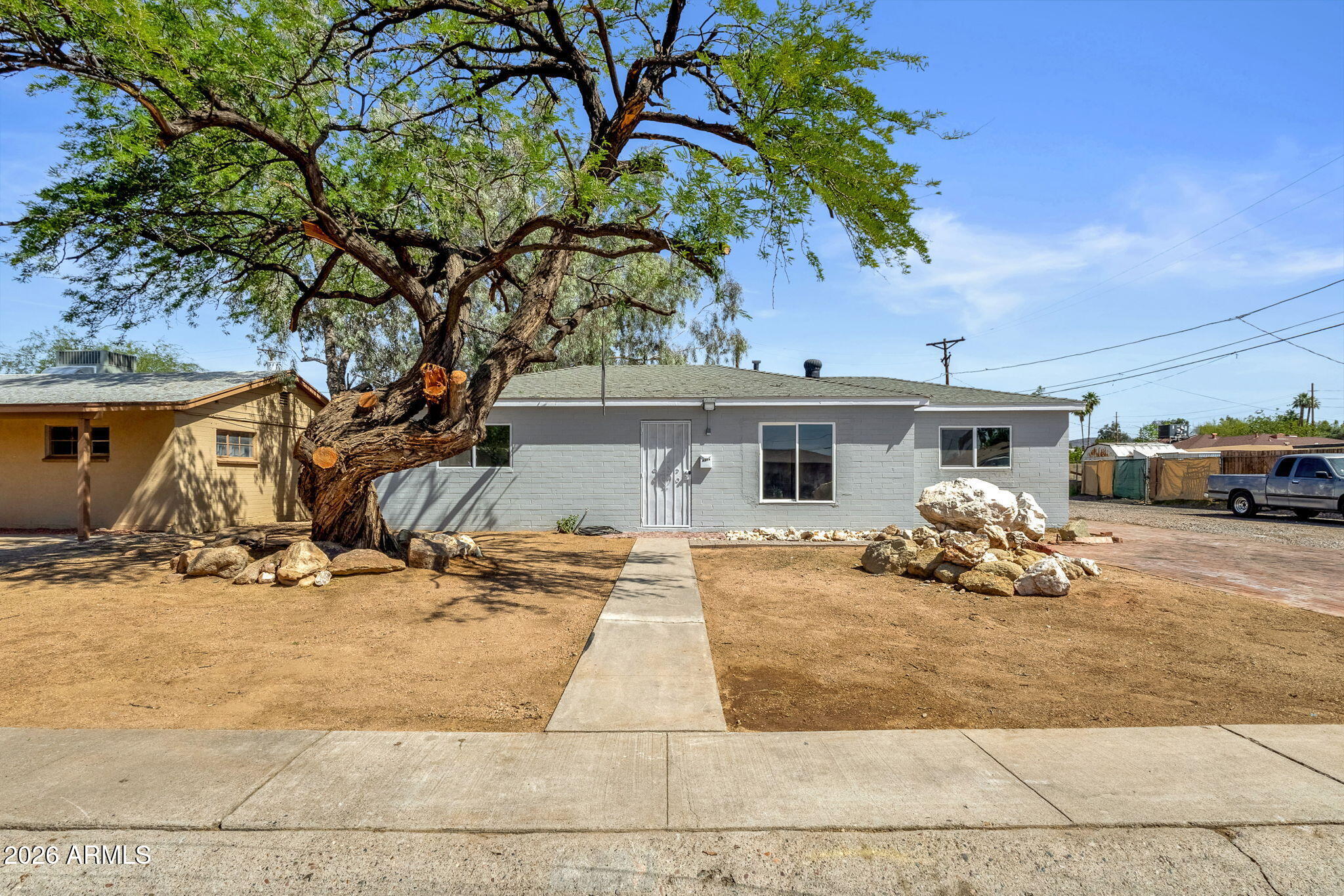ENDLESS POSSIBILITIES & EXPANSION POTENTIAL! Discover this beautifully remodeled, move-in ready Phoenix home that offers so much more than meets the eye. Boasting a massive 714 sq. ft. covered patio, an attached 2-car garage, and ample storage areas with plumbing already nearby, this property is perfectly primed for an easy conversion to an ADU, casita, or additional living space! Set on a generous 9,426 sq. ft. lot with secure gated parking, the property provides the ultimate canvas for flexible indoor-outdoor living. Inside, the home offers 1,032 sq. ft. of brilliantly designed living space featuring 3 bedrooms and 2 bathrooms. Step through the front door to find a refreshed, efficient floor plan highlighted by crisp white interior paint, charming Saltillo-style tile flooring, updated light fixtures, and a bright living area with a large front-facing window. The updated kitchen flows seamlessly into the main living spaces and showcases sleek gray cabinetry, clean white countertops, track lighting, a gas range, and a dishwasher. Everyday convenience is maximized with a dedicated indoor laundry area, elevated by a stylish barn-style sliding door. Whether you want to enjoy the incredible outdoor entertaining space as-is or transform the massive covered areas into your dream home expansion, this rare find is ready for its next chapter! The lot provides room for outdoor seating, gardening, additional parking, storage or future improvements, subject to buyer verification and applicable city requirements. The garage area includes 2-car parking, skylight, storage shelving and a door to the backyard. Multiple storage areas offering options for tools, equipment or workspace needs. Large side/rear gate and alley access add flexibility for parking, trailers or equipment. Located near I-17 access, shopping, restaurants, parks and neighborhood amenities 0.2 mi to Bobby Q BBQ and nearby dining along 27th Ave, with Cortez Park, Rose Mofford Sports Complex, the Metrocenter-area redevelopment and additional retail nearby. A Phoenix property with garage parking, covered outdoor living, storage space and flexible lot potential in a convenient central location!