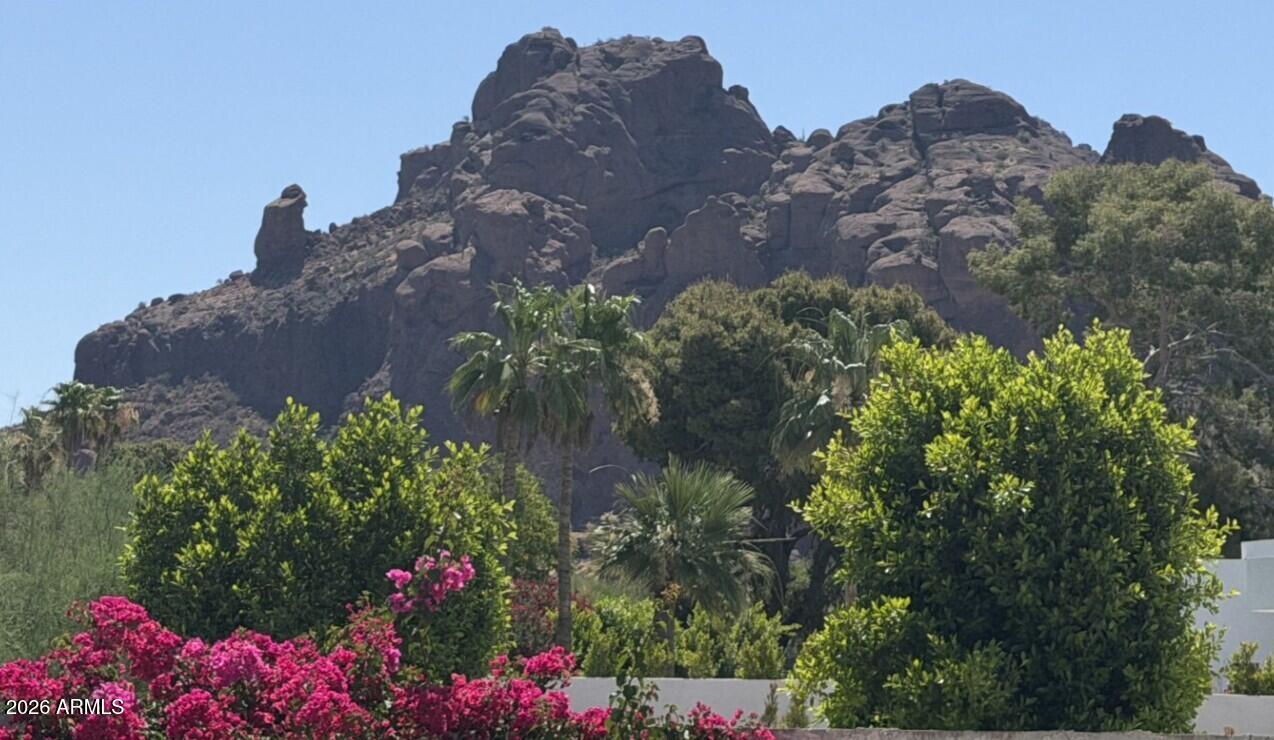You DO NOT want to miss this incredible chance to build in the community of Camelback Canyon Estates.  With a private protected reserve behind the home and an Incredible view of Camelback Mountain with praying monk right there, praying over your home...

Large pie shaped yard with plenty of room to build a tennis or pickleball court, basketball court or anything else your heart can imagine. 

This home is being sold ASIS and will make the perfect home for someone who loves to look at Camelback Mountain..