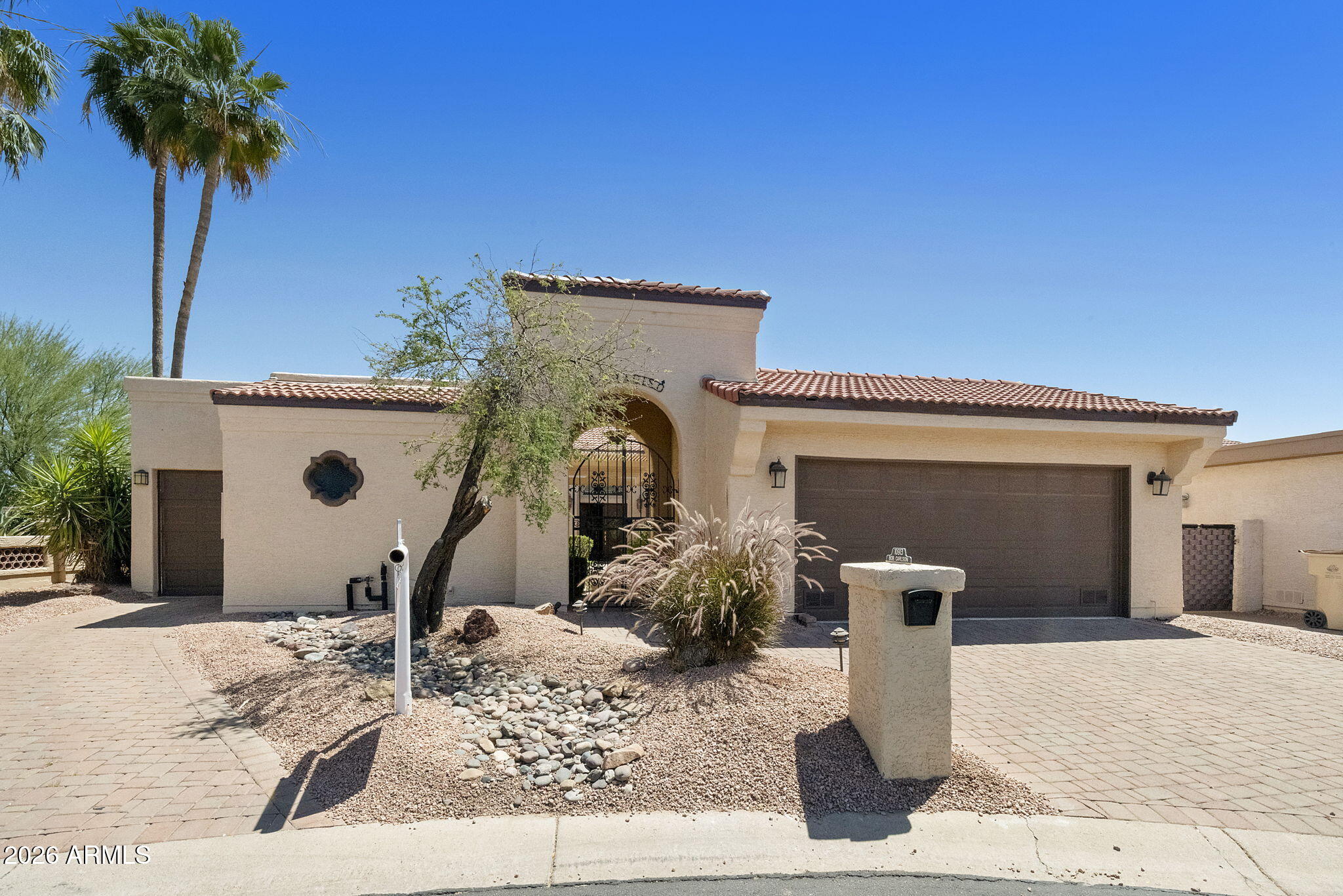 Distinctive 3BR/3.5BA home (including private 266sf casita), golf cart garage, and NEW ROOF 2026. Set on an oversized lot in a private, gated active adult community, this home welcomes you with a charming courtyard entry and ramada. The resort-style backyard is perfect for everyday living and entertaining, with a heated pool, spa, BBQ area, multiple gathering spaces, wrap-around patio, and ramada with commercial-grade misting system. Inside, vaulted ceilings create an open, comfortable great room with fireplace and custom entertainment wall. The kitchen features granite counters, SS appliances, and a bright in-kitchen breakfast nook, while the extended dining area is ideal for hosting family and friends. The spacious primary suite offers a private covered patio and an updated SEE MORE spa-like bath with raised granite counters, soaking tub, and walk-in shower. Secondary bedroom/office with built-ins and updated bath. Private casita with full bath and walk-in closet--perfect for guests or extended stays. Palo Verde offers 2 golf courses, multiple pools, 2 clubhouses, tennis, pickleball, modern fitness center & more!