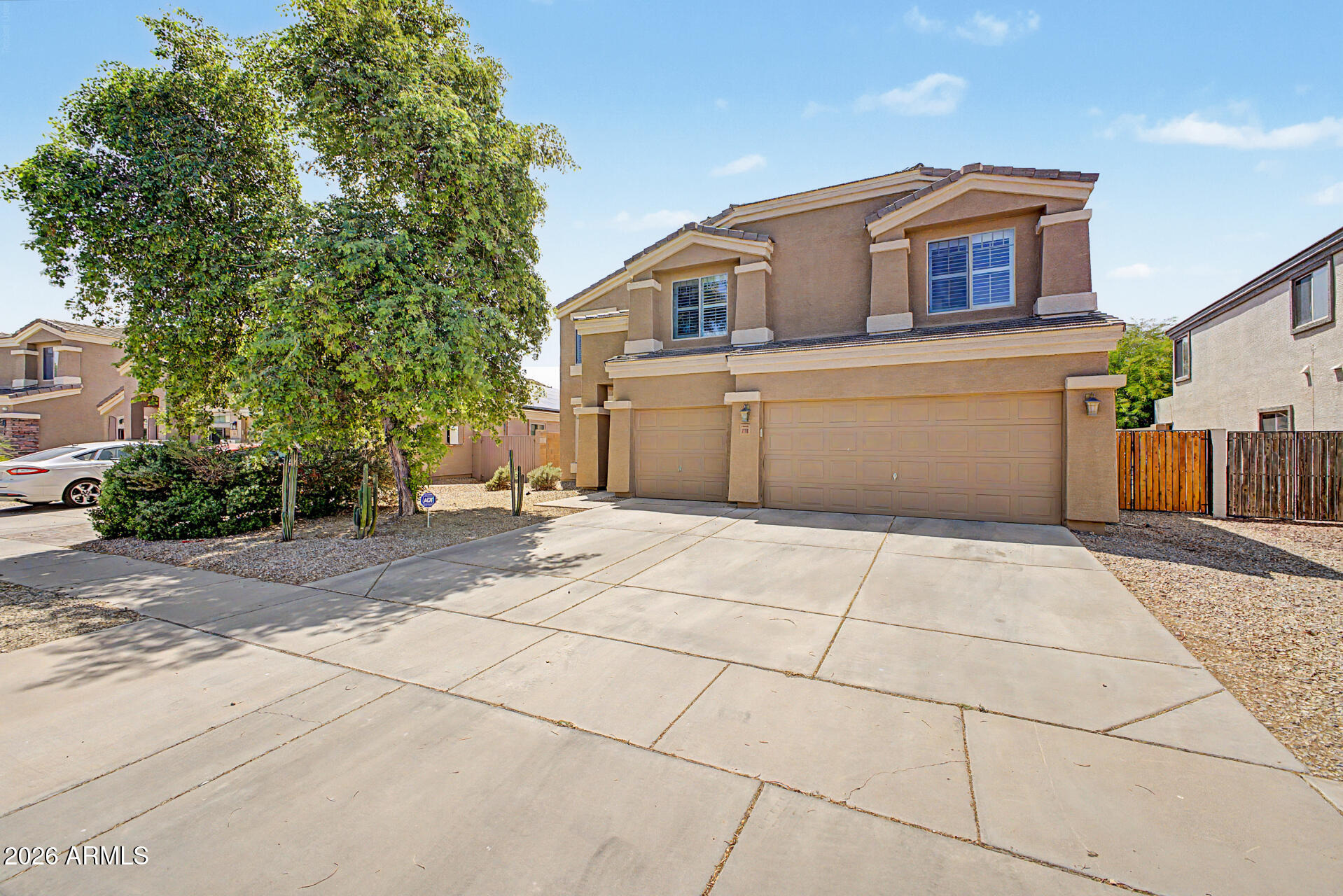 VA assumable loan available at an incredible fixed 2.299% interest rate for qualified buyers! Huge price improvement! This energy-efficient 5-bedroom home offers the space, flexibility, and upgrades today's buyers are looking for. The thoughtfully designed floor plan includes a private first-floor bedroom and full bathroom with a walk-in shower, making it ideal for multigenerational living, extended guests, or a dedicated home office. The open-concept main level features easy-care tile flooring throughout, while fresh carpet upstairs adds a clean, updated feel. The spacious primary suite offers a large walk-in closet and dual-sink vanity, complemented by four additional bedrooms, three full bathrooms, and an oversized loft that's perfect for a media room, game room, homework space, or second living area. system upgrades provide peace of mind, including two newer HVAC systems--one just three years old and the other only two years old. A Paragon whole-home water treatment system, custom shutters, and fresh interior paint add even more value. One of the home's biggest advantages is its prepaid solar system, currently generating APS bill credits and keeping average monthly electric costs at approximately $25. The low-maintenance backyard features mature fruit trees and a like-new storage shed, while the three-car garage offers plenty of room for vehicles, storage, a workshop, or home gym. With a rare low-interest assumable VA mortgage, exceptional energy savings, flexible living spaces, and numerous recent upgrades, this home delivers outstanding value for buyers seeking both comfort and long-term affordability.