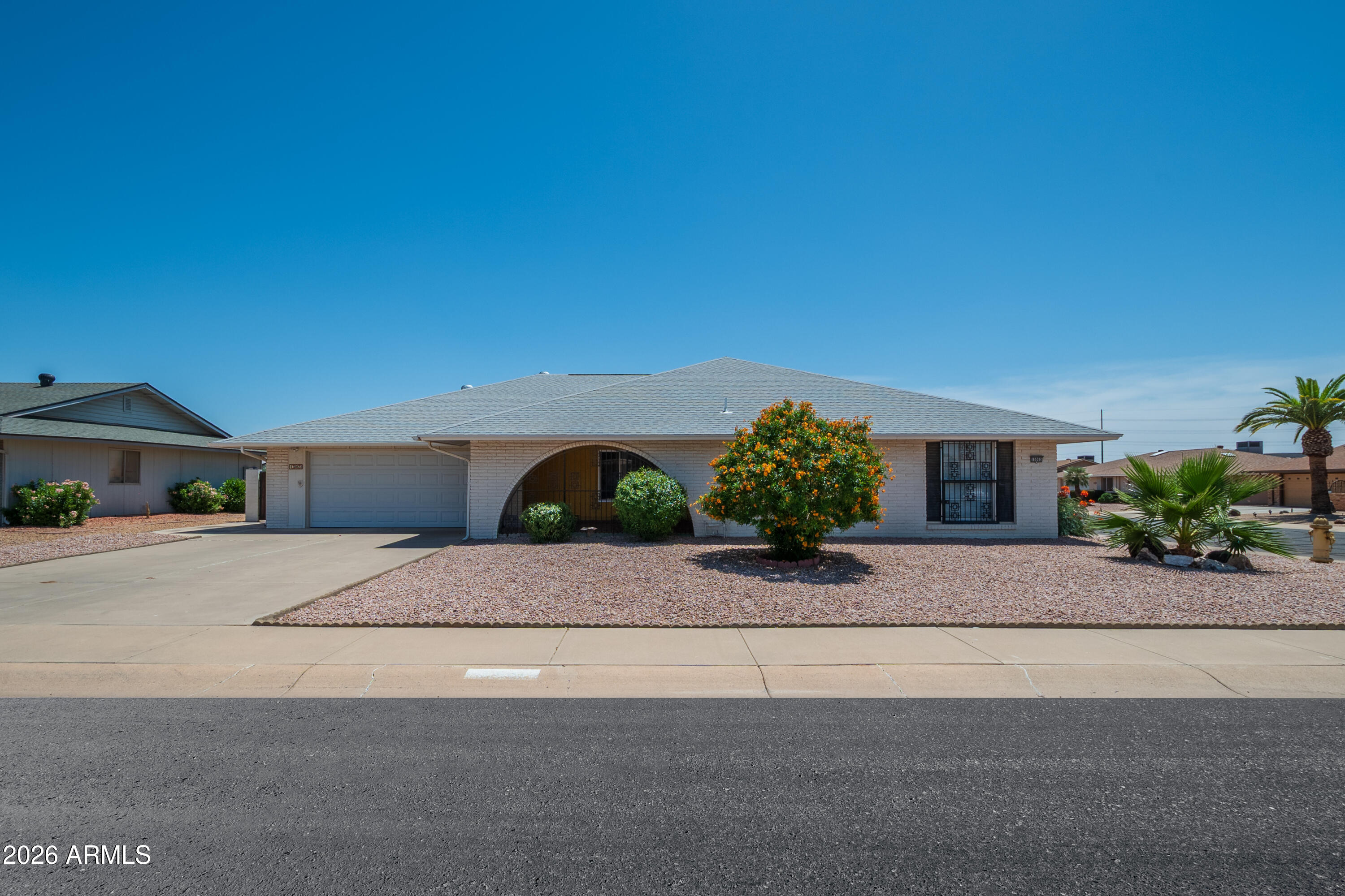 Neat and clean 3 bedroom 2 bath home located o a large corner lot in Beautiful Sun City West,  Arizona.  This home has spacious living room, 3 bedrooms and 2 bathrooms.  The kitchen has a newer wall mounted oven and flat top cooking surface and a lot of storage space..  The flooring is tile and Laminate/vinal through out.  The laundry room is is large and gives you many options to have a hobby room, office or den.  the primary bedroom has 2 walk-in closets and the bath has a walk-in shower.  The back patio is screened in and over looks a fully fenced back nicely decorated back  yard,
.