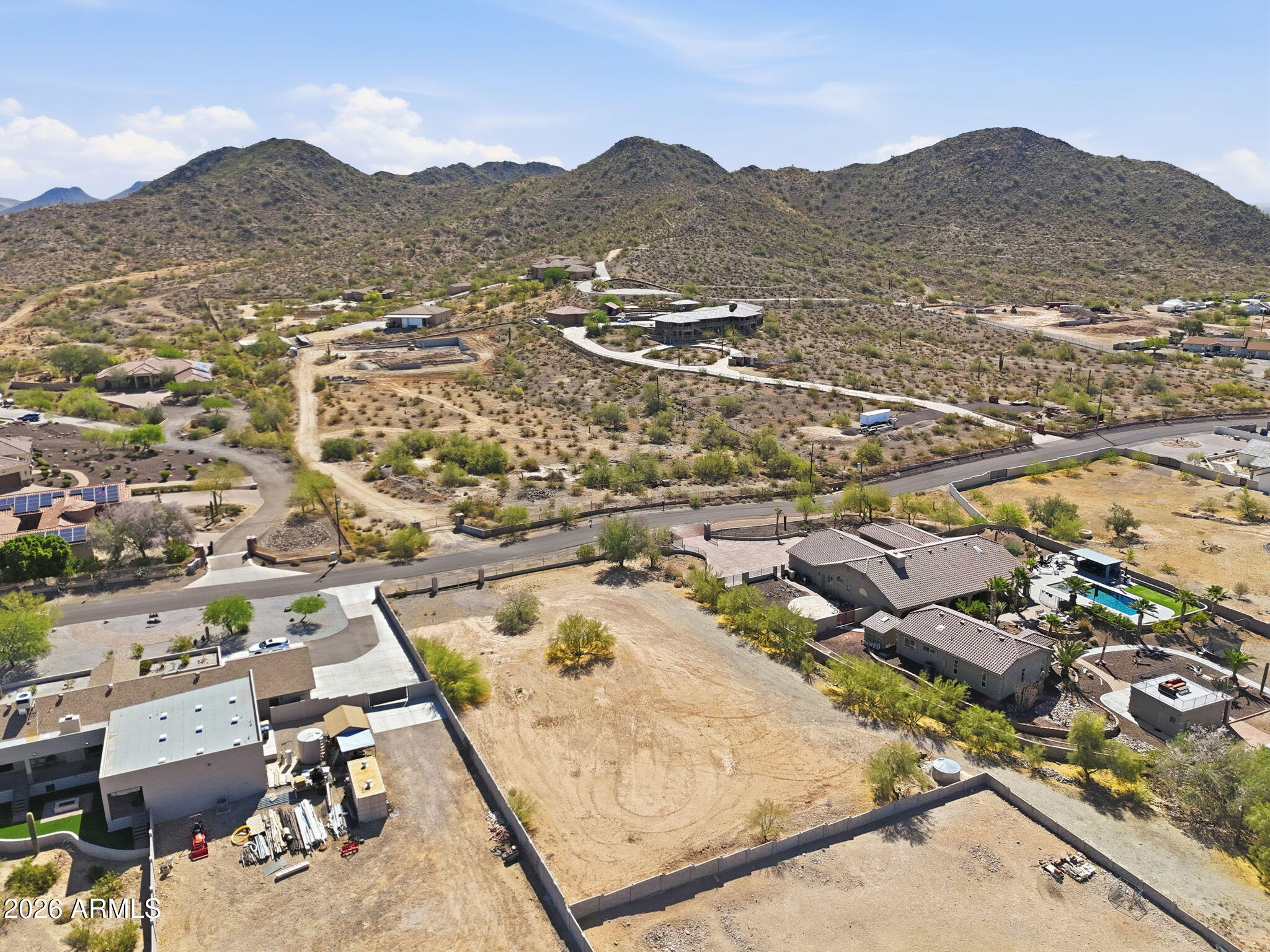 Rare opportunity to own a flat one acre lot in one of North Peoria's most desirable areas. This stunning lot offers mountain views & city views with full paved road access, and is surounded by custom multi-million-dollar homes. Topographical survey has been completed and is available. Incredible opportunity to  build your custom dream home on this stunning piece of land. Located just minutes from the Four Corners area for easy access to shopping, dining, and entertainment. MUST SEE!
