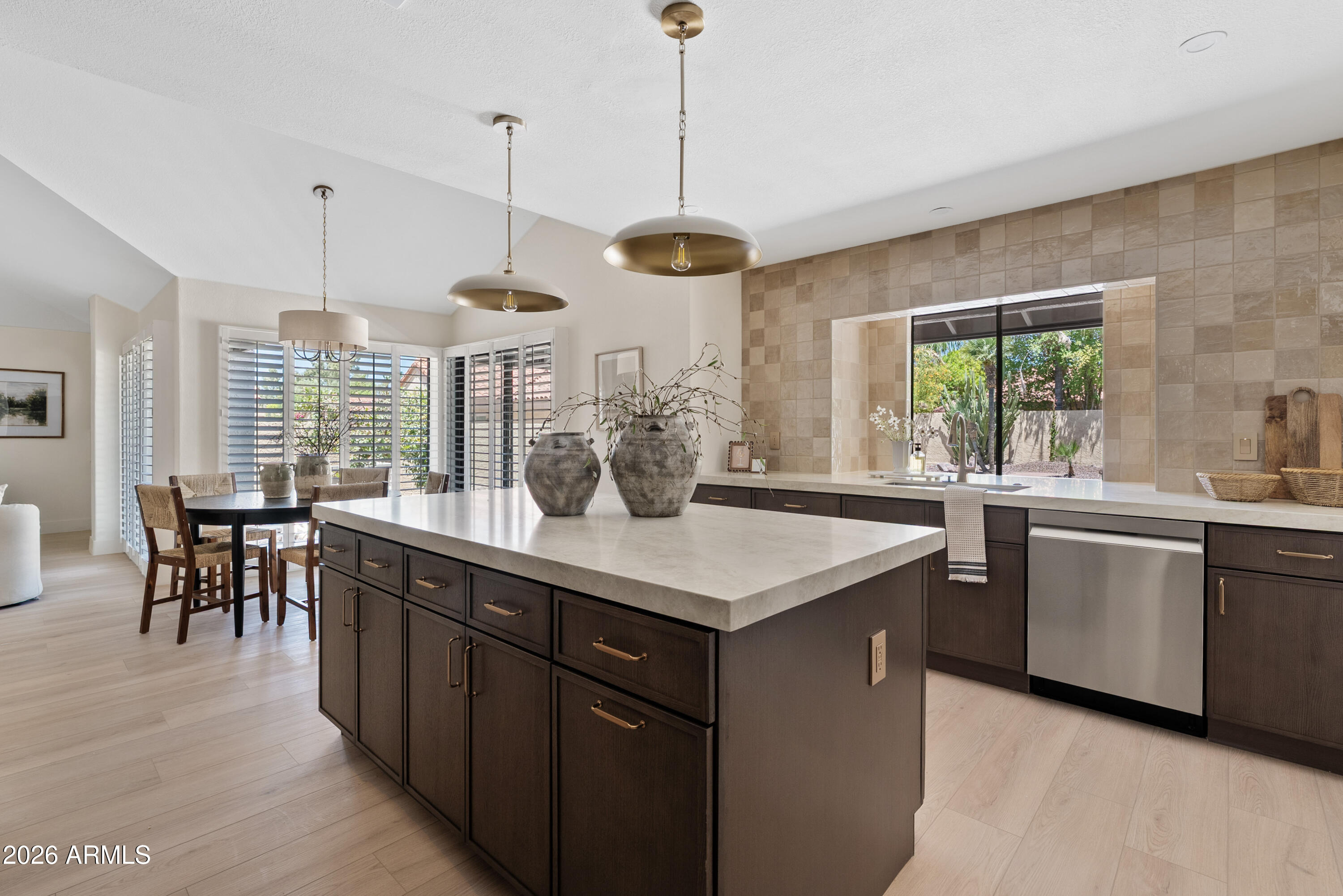 Welcome to this beautifully remodeled home in Scottsdale Ranch! Step inside to discover an updated kitchen featuring new cabinetry, quartz countertops, a large island, and ss appliances. Natural light pours into the open-concept living spaces through brand new dual-pane windows, creating a bright and inviting atmosphere throughout. The thoughtfully designed floor plan includes a versatile den that can easily be converted into an additional bedroom, offering flexibility to meet your lifestyle needs. Outdoors, enjoy your own private oasis with a covered patio and a sparkling pool featuring brand new PebbleTec, updated equipment, and new pool decking - perfect for relaxing or entertaining year-round. Located just minutes from Loop 101, premier dining, shopping, and top-rated schools!