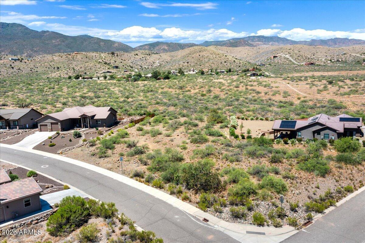 Discover the perfect setting for your dream home nestled in the foothills in Clarkdale, this exceptional lot offers a rare combination of serene privacy and dramatic natural beauty. Design your own dream home or choose from plans that can be customized to your liking. HOA approved blueprints designed with a rooftop view deck included with the property -  Builder estimates available! Imagine waking up to jaw-dropping, panoramic views of Mingus Mountain and the legendary Red Rocks of Sedona. This property features pristine high-desert landscaping, providing a sophisticated backdrop for a custom architectural masterpiece designed to harmonize with the local environment.