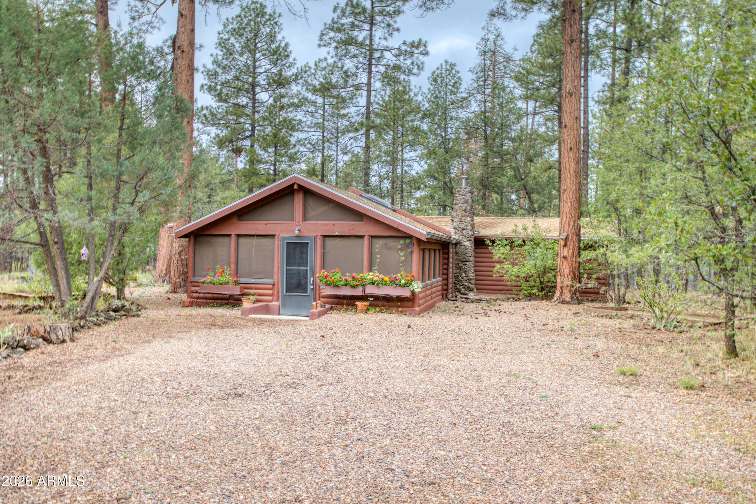 Tucked away among the majestic pines of Lakeside Summer Homes, this inviting log cabin retreat embodies the charm and tranquility of mountain living. Set on a beautifully wooded lot in the heart of Lakeside, the property offers a peaceful setting where nature and privacy take center stage. From the moment you arrive, the classic cabin exterior and serene surroundings create an immediate sense of escape. Inside, you'll find generously sized bedrooms, warm wood accents, and a cozy atmosphere that perfectly complements the home's rustic character. The massive screened-in porch serves as the true focal point of the property, an ideal place to enjoy your morning coffee, entertain family and friends, dine al fresco, or simply relax and take in the cool mountain air beneath the towering pines. This cabin is centrally located in the Lakeside Summer Homes custom homes on larger lots.

*** Recent improvements provide peace of mind, including a new roof, gutters/downspouts, and skylights completed in 2026.

Whether you're searching for a full-time residence, weekend retreat, or vacation getaway, this property delivers the perfect cabin lifestyle with room to unwind and create lasting memories.

Beyond the home itself, the White Mountains lifestyle is second to none. Residents enjoy easy access to the charming communities of Show Low, Pinetop, and Lakeside, known for year-round festivals, classic car shows, seasonal carnivals, farmers markets, art fairs, rodeos, and community events that bring the mountain towns to life. Golf enthusiasts will appreciate nearby championship golf courses and private clubs, while outdoor lovers can enjoy hiking, fishing, boating, skiing, and endless opportunities to explore Arizona's breathtaking high country.

The area truly offers something for everyone; from boutique shopping, spas, wineries, coffee shops, and fine dining to family-friendly parks, playgrounds, seasonal events, and summer activities children will love. Whether spending the day on the golf course, attending a local festival, exploring the lakes, or simply relaxing beneath the pines, this home offers a lifestyle centered around recreation, connection, and unforgettable mountain memories.