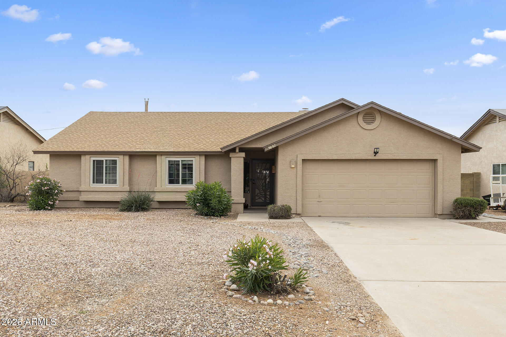 NO HOA • RV & Trailer Friendly • Privacy, Space & Mountain Living in Gold Canyon
This well-maintained 3-bedroom home offers: Generous frontage, wide streets, and the flexibility to make the property your own. Attractive seller stimulus includes Buyer Financing Incentive plus One-Year Home Warranty. Situated on a quiet street and backing to a wash for added privacy, this property provides room to spread out while remaining conveniently close to everyday amenities. 
Inside, you'll find vaulted ceilings throughout, spacious bedrooms, a statement fireplace, and an open layout that creates a bright, welcoming atmosphere. The kitchen features stainless steel appliances, pantry storage, breakfast bar seating, and an adjoining dining area with direct access to the backyard. The primary suite includes French doors leading to the patio, dual vanities, and a walk-in closet.
Enjoy Arizona evenings under the covered patio and pergola, with extended pavers, low-maintenance landscaping, block fencing, and the added privacy of no rear neighbors.
Located minutes from shopping, golf, schools, the Superstition Mountains, Tonto National Forest, and convenient access to Phoenix-area airports.