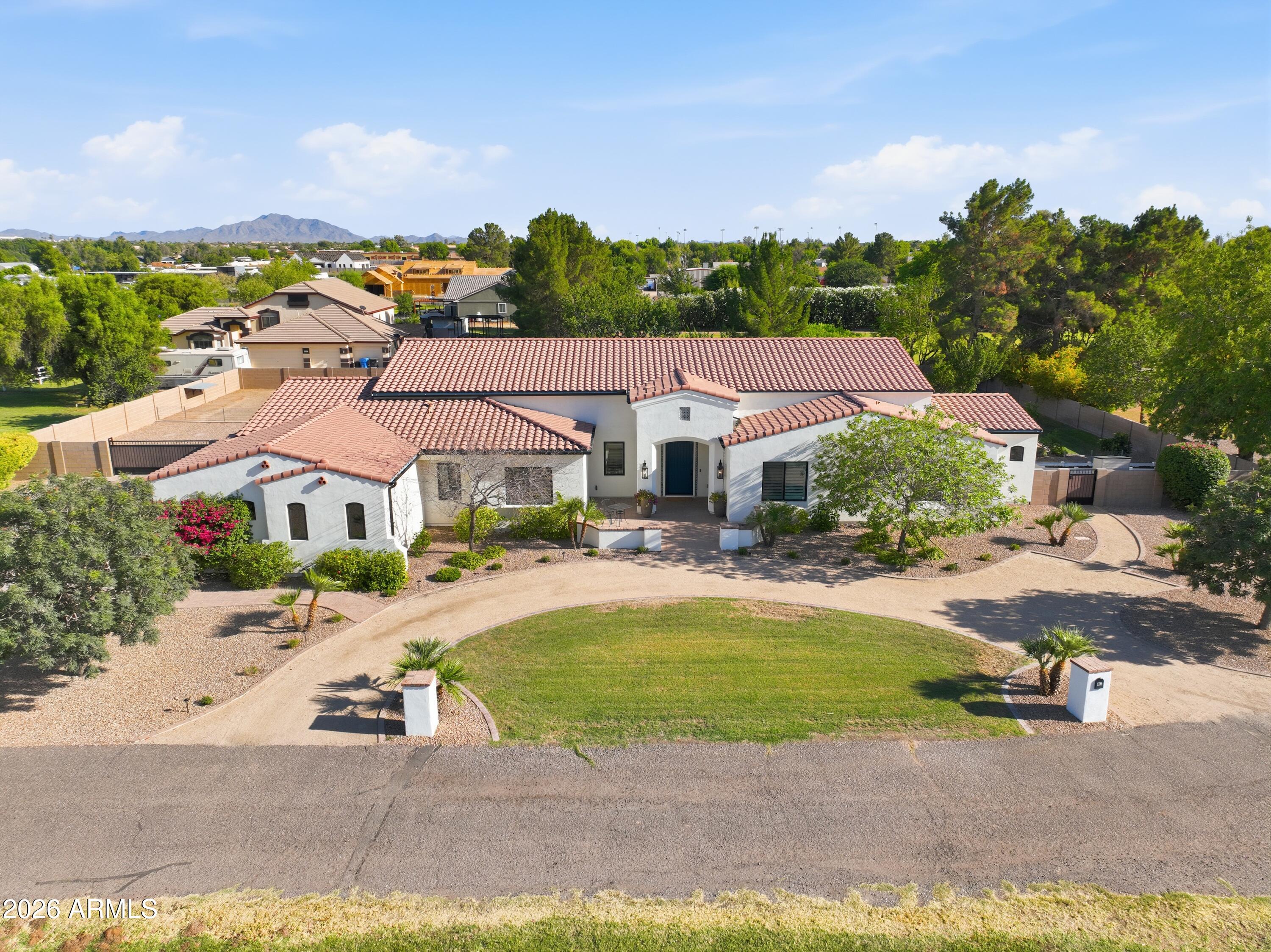 Gorgeous Santa Barbara Style Custom Home built in 2018 on nearly an acre lot IN GILBERT w/NO HOA! 
Open Floor Plan w/resort style Backyard... Sparkling Salt System Pool w/basketball hoop, Cozy Firepit, Outdoor TV & kitchen equipped w/built-in BBQ Grill + Green Egg Smoker great for entertaining. Raised Garden Beds for those w/a green thumb. Casita or RV Pad w/utility stub-outs (electrical/water/septic) for added future value. Fenced/useable land creates flexibility for toys. Oversized 4-car garage + added storage.
INTERIOR boasts beautiful Great Room ceiling beams, kitchen induction cooktop, window shutters, designer bathrooms, central vac, surround sound, & many other upgrades you'll love!
COME SEE THIS RARE... LARGE LOT...  STUNNING NEWER GILBERT CUSTOM PROPERTY THAT HAS NO HOA FEES