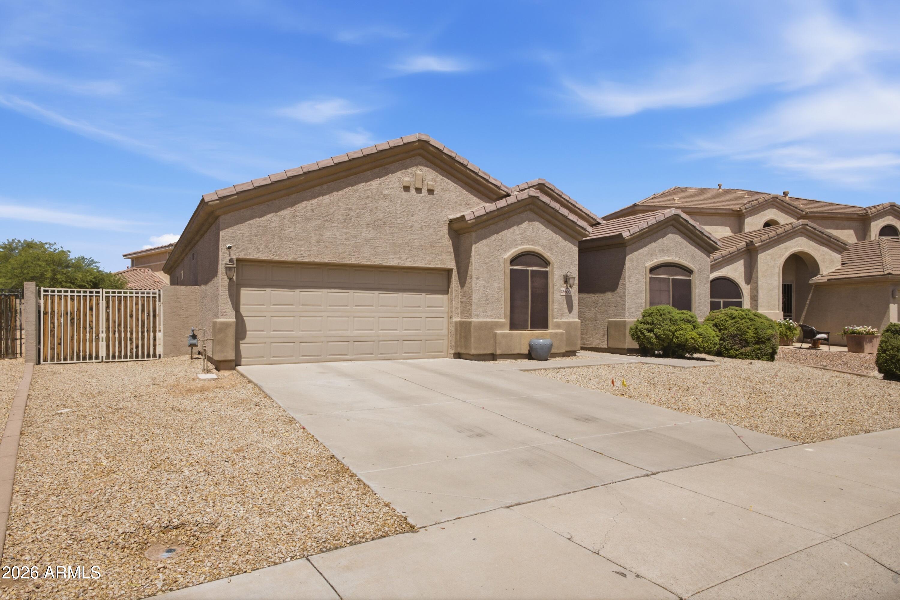 Welcome to this beautifully remodeled home in the highly sought-after gated community of Palm Valley, perfectly positioned on the golf course with a sparkling pool and stunning backyard views. Featuring a popular open split floor plan with 3 bedrooms plus a versatile den that can easily serve as a 4th bedroom, this home seamlessly blends modern design with everyday comfort. Every detail has been thoughtfully updated, including oversized wood-look plank tile flooring throughout, fresh interior and exterior paint, custom crown molding, all-new modern lighting and ceiling fans, LED recessed lighting, sleek black door hardware, and keyless front entry. The chef-inspired kitchen showcases 42-inch upper cabinets, quartz countertops, a waterfall-edge island, designer tile backsplash, stainless steel appliances that are all brand new and barely used, and abundant space for gathering and entertaining.

Both bathrooms have been completely remodeled with upscale finishes, including quartz countertops, designer fixtures, upgraded hardware, new undermount sinks, and new toilets. The spacious primary suite is a true retreat, featuring dual vanities, a beautifully tiled walk-in shower, a generous walk-in closet, a convenient linen closet, and private access to the backyard--perfect for stepping outside to enjoy a morning coffee or an evening swim.

Designed for easy Arizona living, the resort-style backyard offers a sparkling pool overlooking the golf course, low-maintenance desert landscaping, artificial turf, a putting green, mature lemon and grapefruit trees, a raised garden bed, exterior sun shades, and a newly installed automatic drip system. Whether you're entertaining friends or simply enjoying the peaceful golf course setting, this outdoor space is sure to impress.

Additional upgrades include a Rinnai tankless water heater, water softener, remote-controlled living room shades, a new garage door and tracks, and an RV gate for added convenience and flexibility.

With exceptional craftsmanship, thoughtful upgrades, and a premium golf course views, located in Palm Valley one of Goodyear's most desirable gated communities, this truly move-in-ready home offers the perfect combination of style, comfort, and functionality. This is a home that must be experienced in person to fully appreciate everything it has to offer.