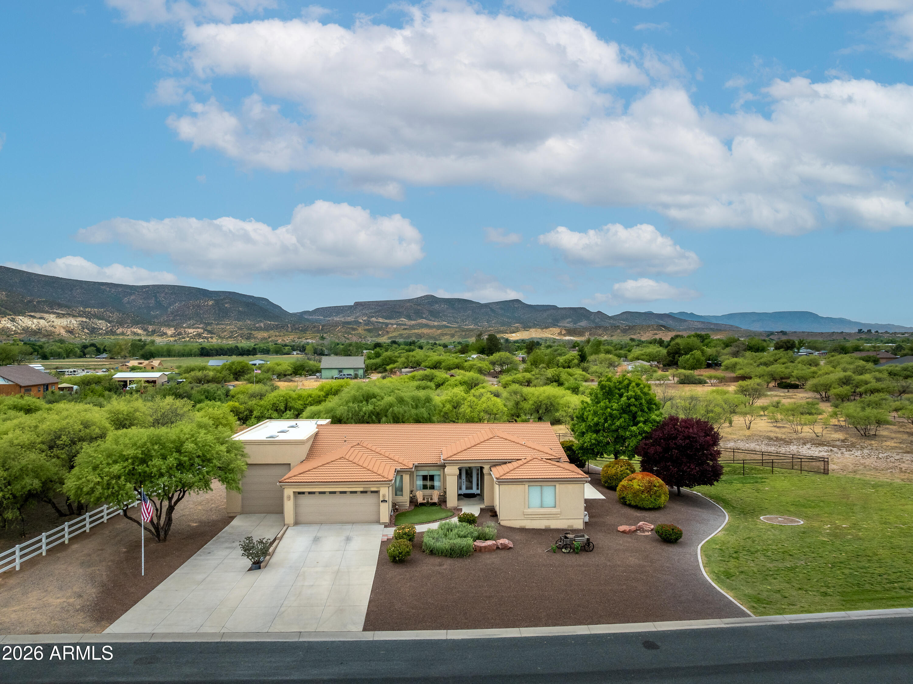 If you've been looking for space, quality, and style in one of Camp Verde's best neighborhoods, this classy property delivers it all. Elegant 3-bedroom, 3-bath home offering 2,391 sq ft of refined living on 1.6 acres. Designed for both style and comfort, this home features beautiful plank tile flooring and a thoughtfully designed open layout that feels sophisticated and inviting. The chef's kitchen is perfect for cooking and entertaining, and the spacious primary suite offers a relaxing retreat with a large bedroom and impressive walk-in closet. The property also includes a 2-car attached garage and separate RV garage for exceptional storage. Enjoy the beautifully maintained backyard, providing a safe space for your furry friends and a peaceful setting to relax and unwind.  Don't miss out.